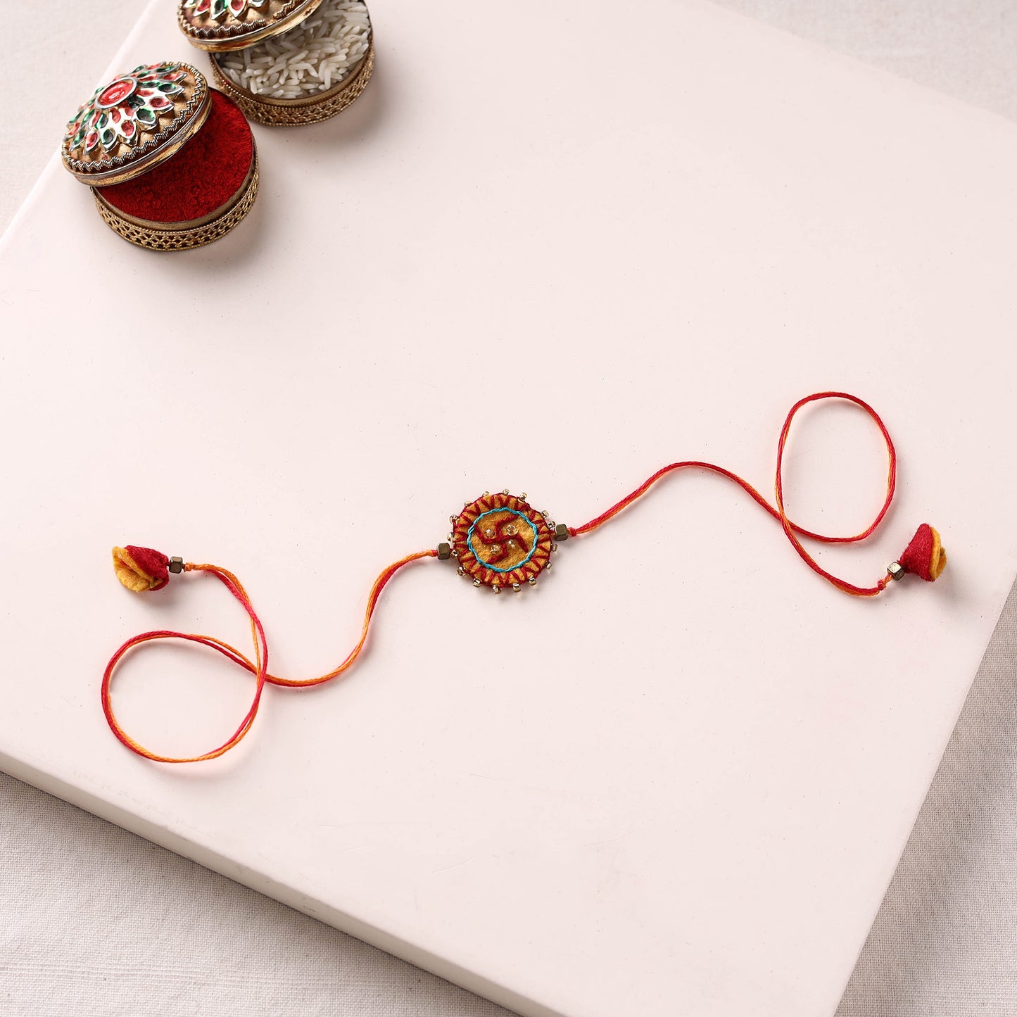 Swastika - Hand Embroidered Felt & Bead Work Rakhi 07