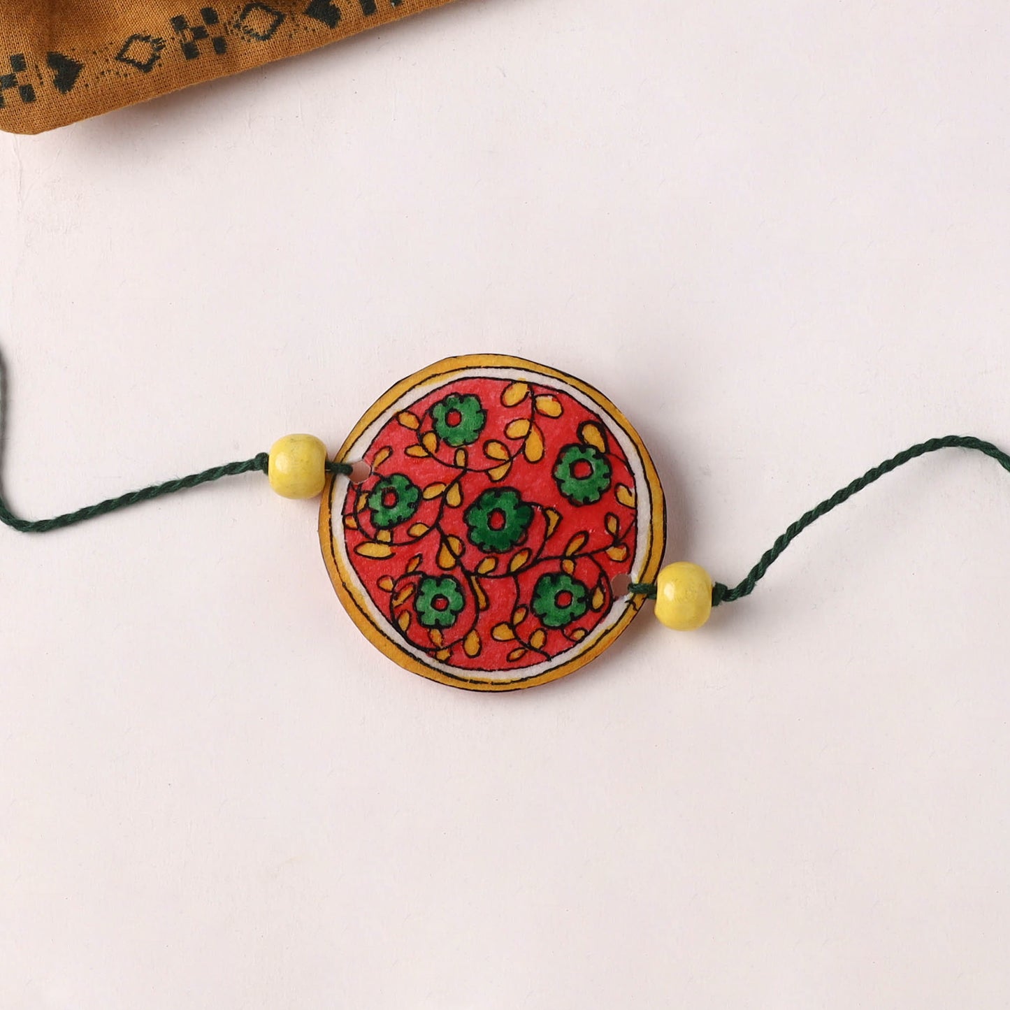 Flower - Handpainted Tholu Bommalata Leather Rakhi (Assorted) 05