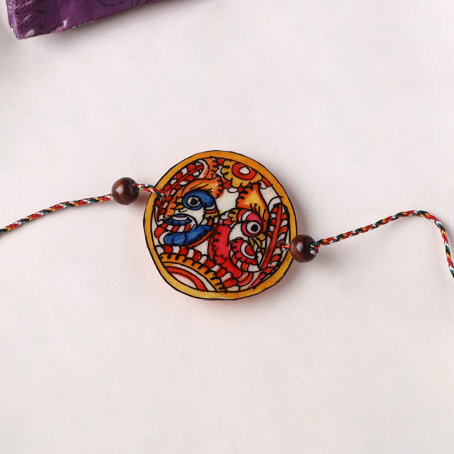 Peacocks - Handpainted Tholu Bommalata Leather Rakhi (Assorted) 22