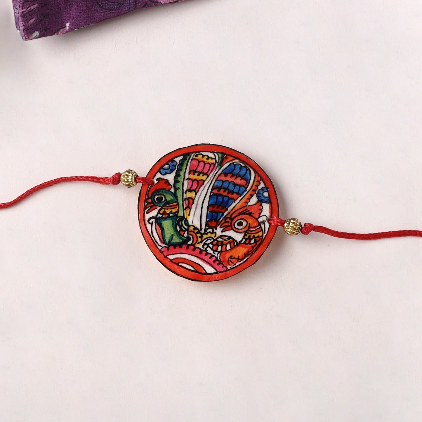 Peacocks - Handpainted Tholu Bommalata Leather Rakhi (Assorted) 23