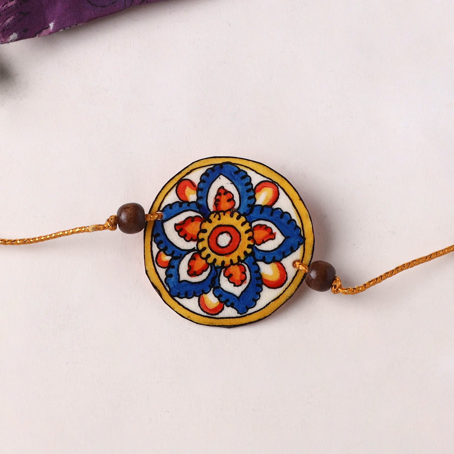 Handpainted Tholu Bommalata Leather Rakhi (Assorted) 25