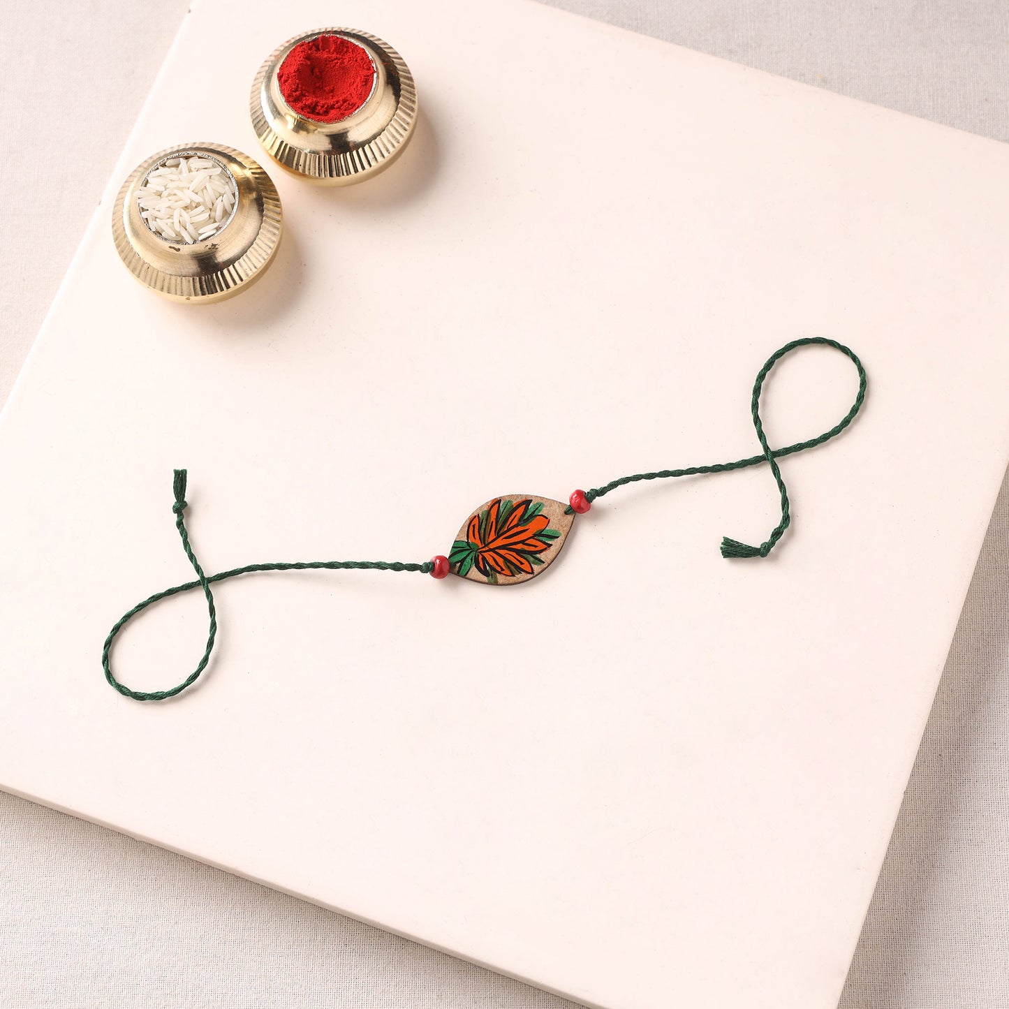 Pattachitra Handpainted Wooden Rakhi 26