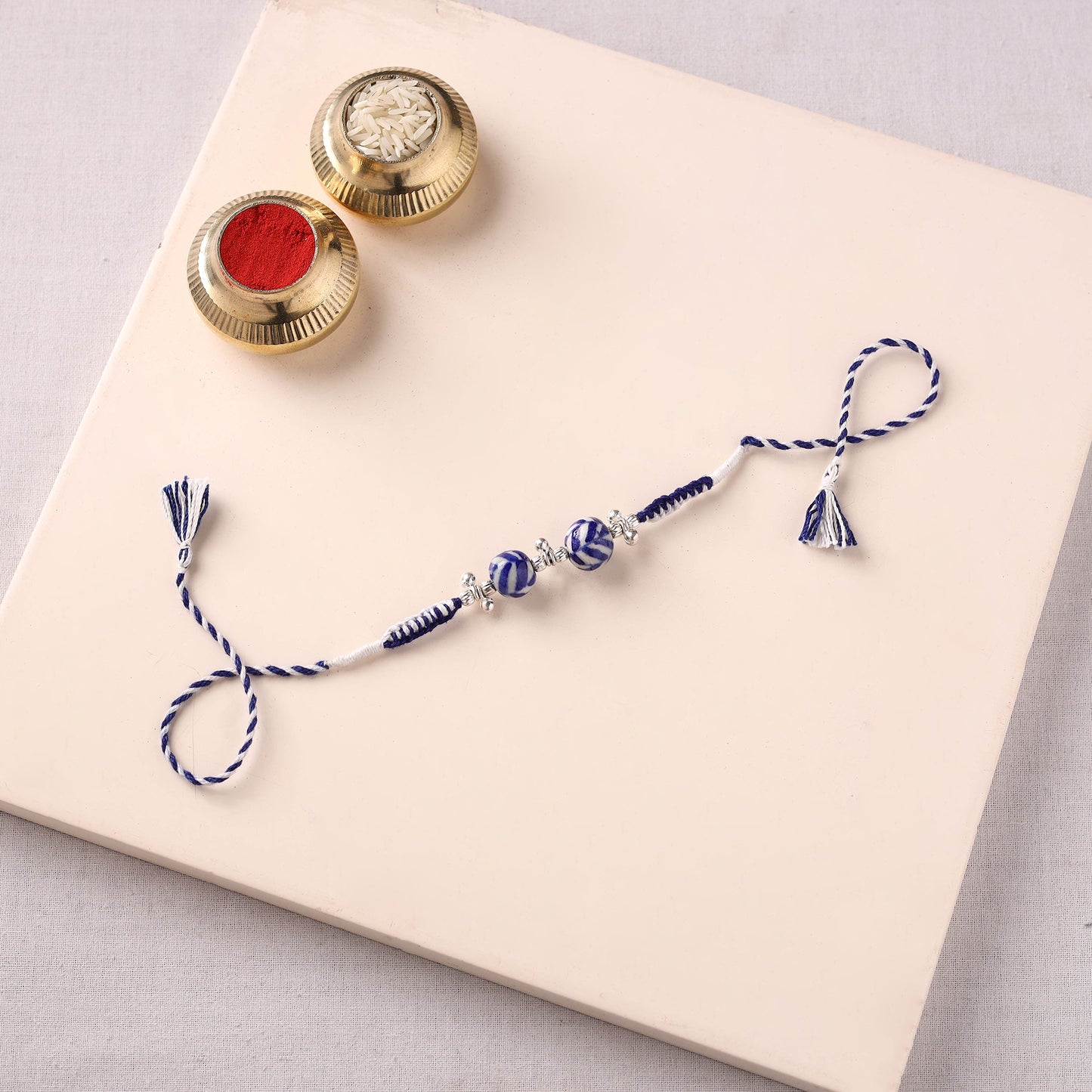 Handcrafted Patwa Threadwork Blue Pottery Beads Rakhi 09