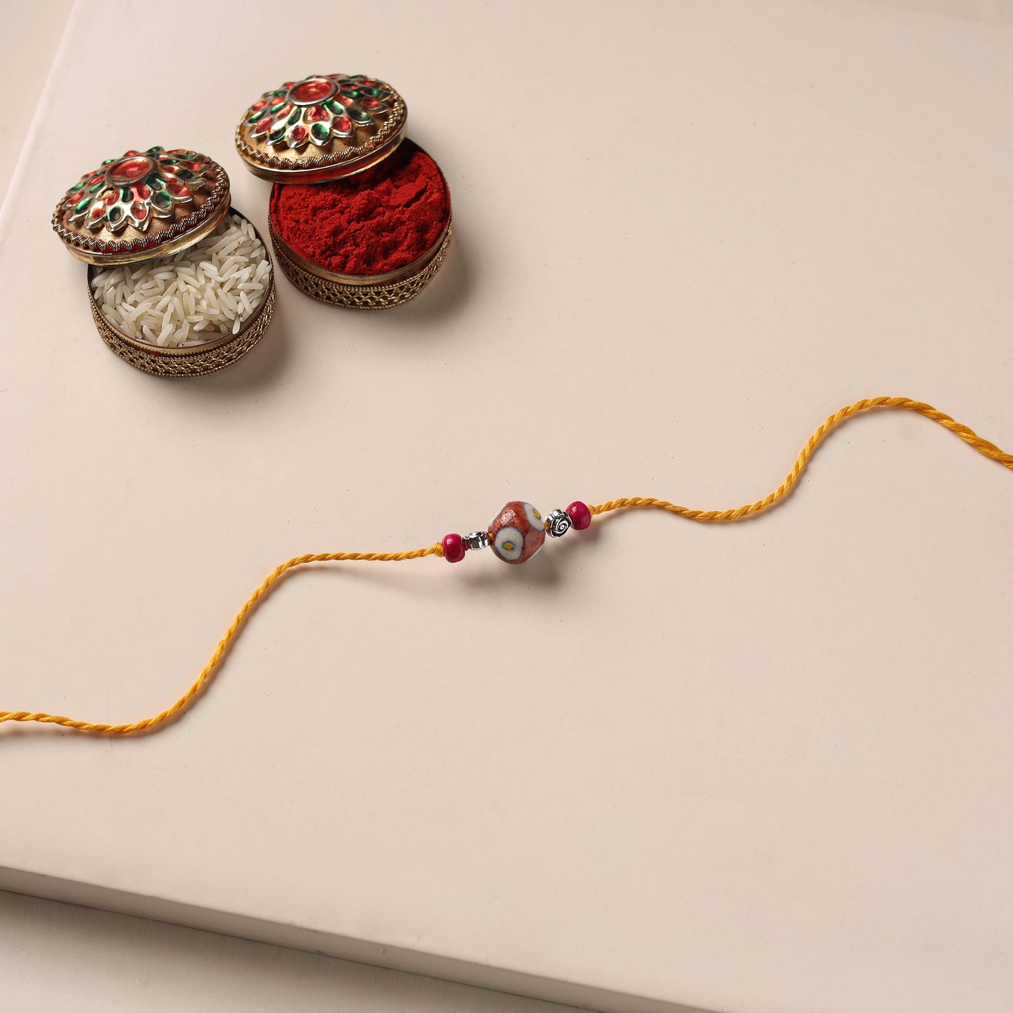Handmade Blue Pottery & GS Bead Work Rakhi 03