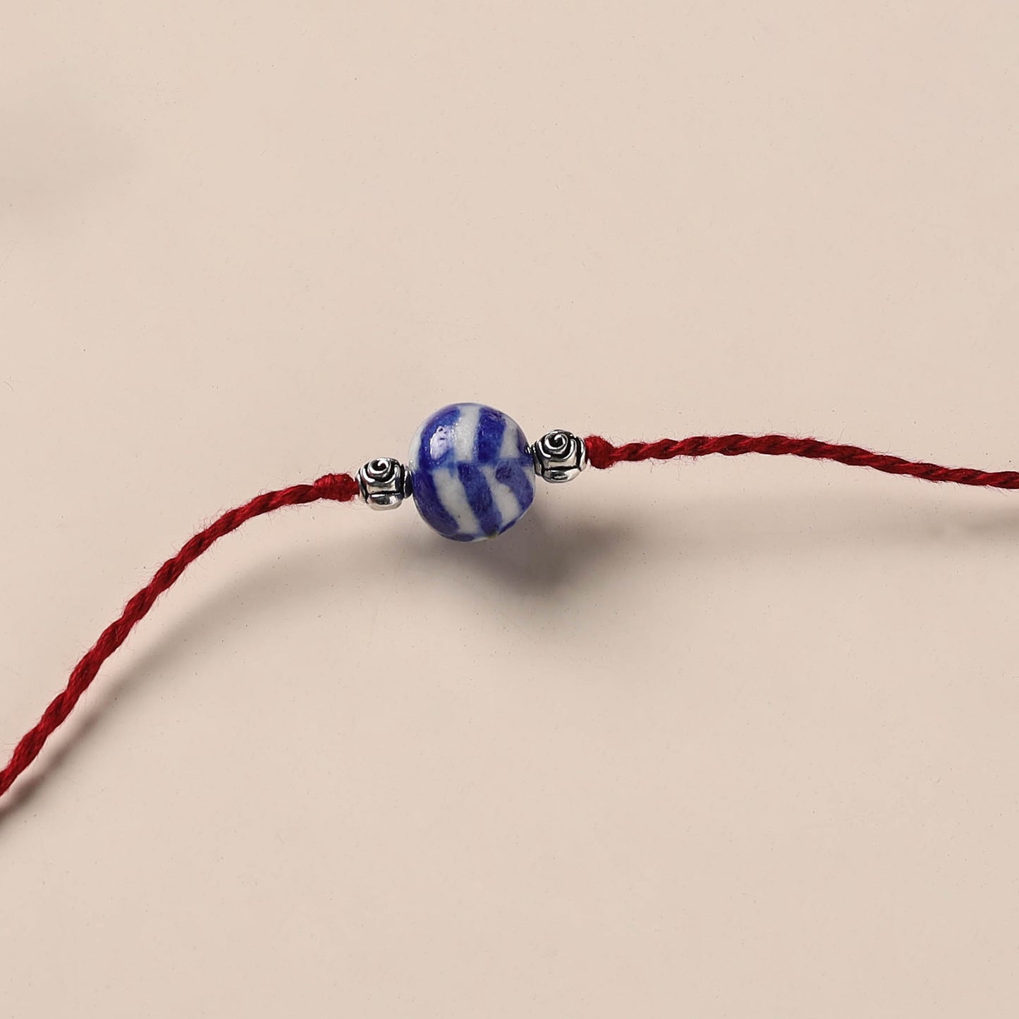 Handmade Blue Pottery & GS Bead Work Rakhi 04
