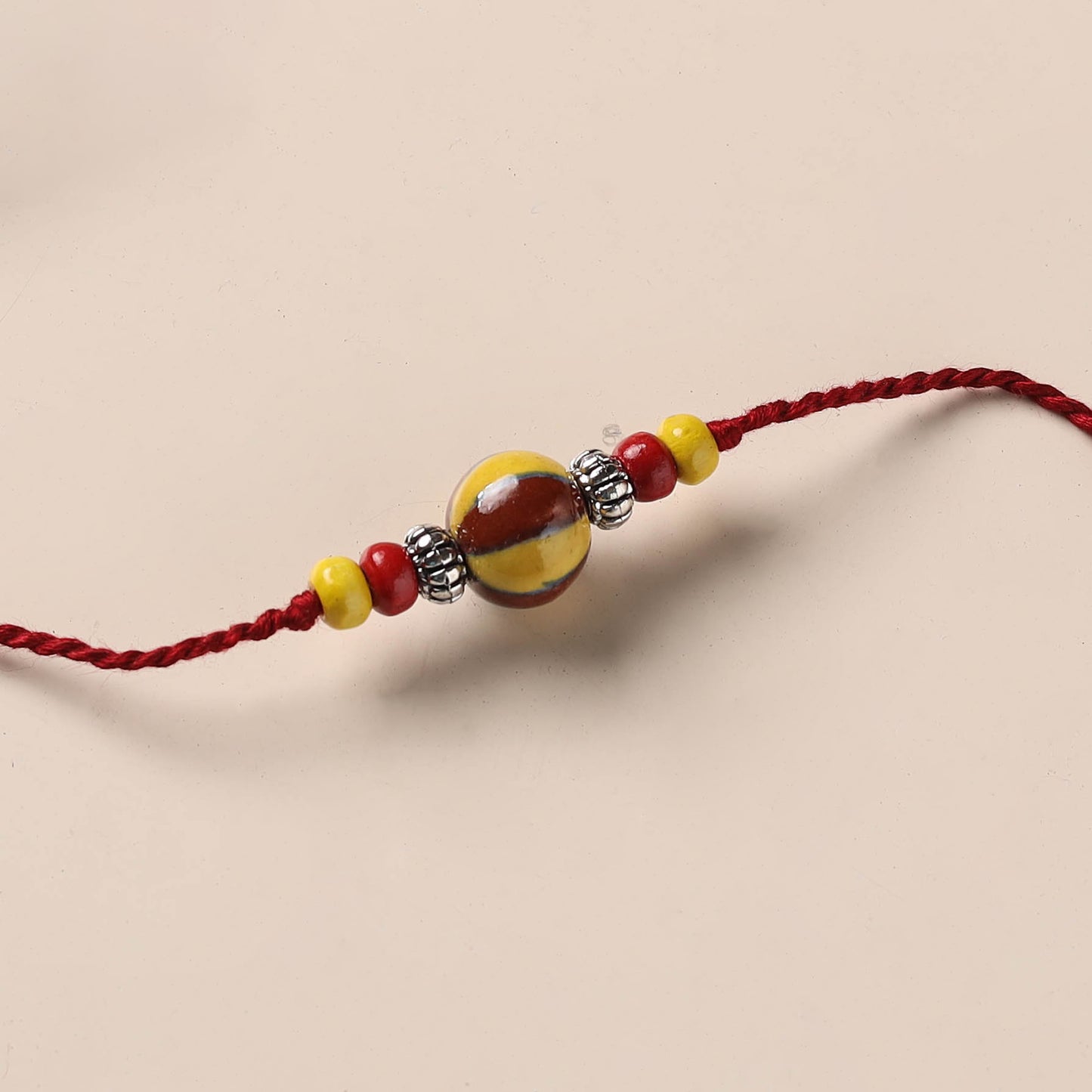 Handmade Blue Pottery & GS Bead Work Rakhi 08