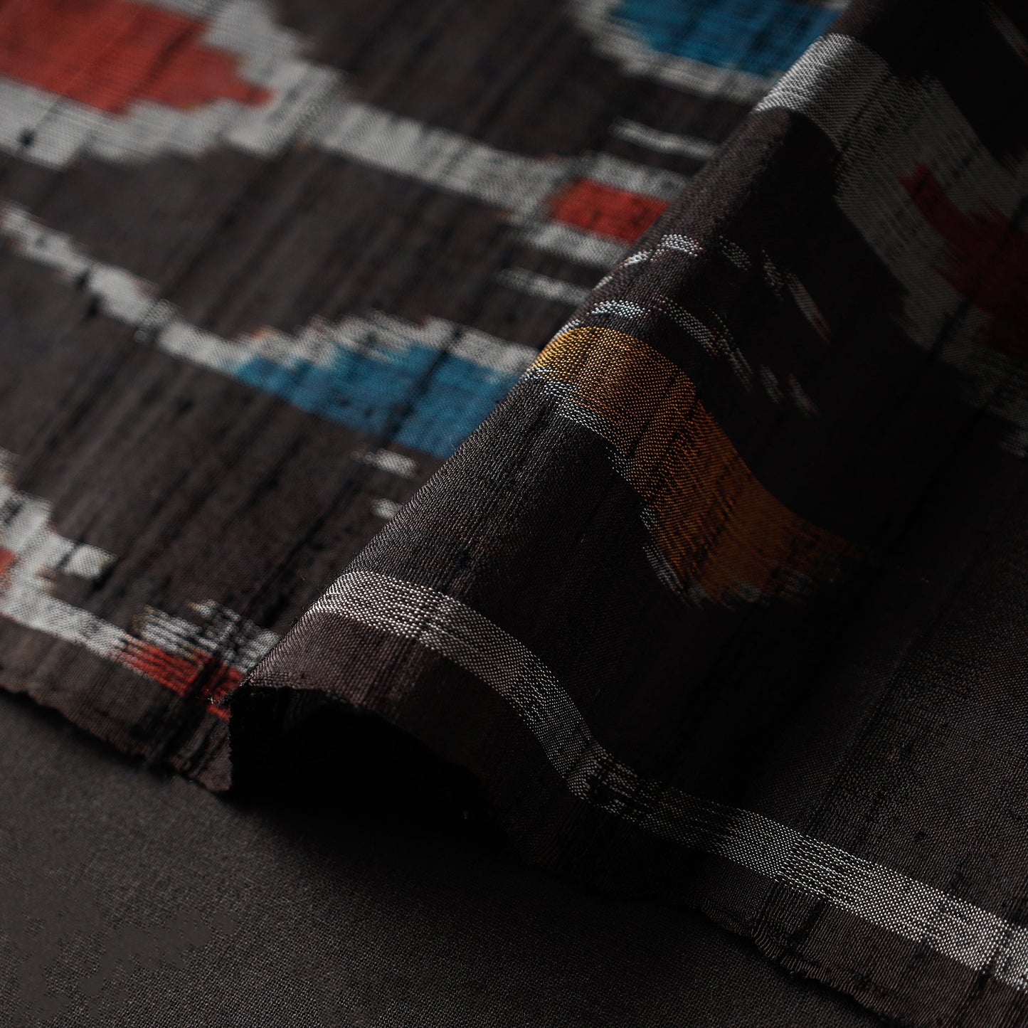 Multicolor Patterns On Black Pochampally Ikat Raw Silk Pure Handloom Fabric