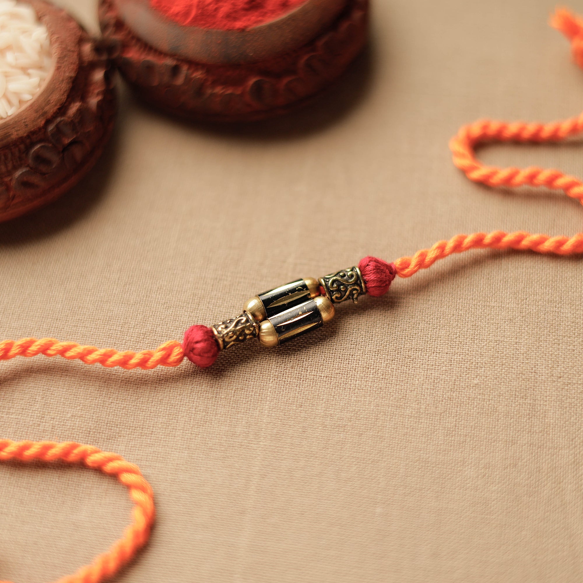 Tribal Dokra Craft Brass Rakhi by Miharu 23