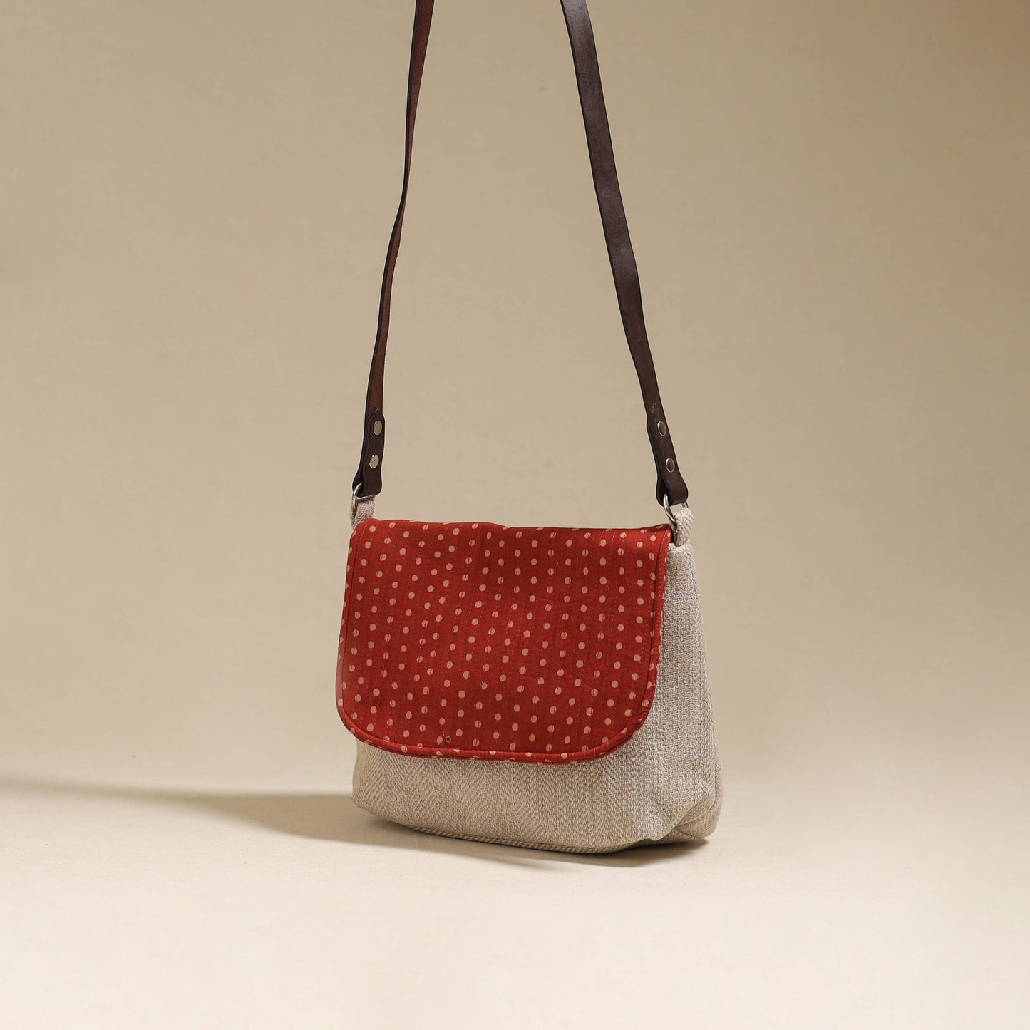 Handcrafted quilted ajrakh block printed fabric sling bag