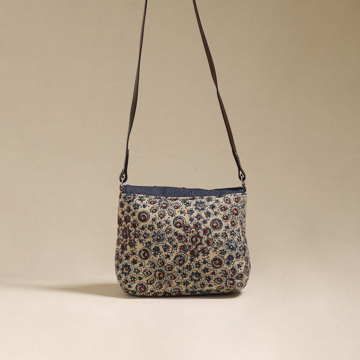 Handcrafted quilted ajrakh block printed fabric sling bag