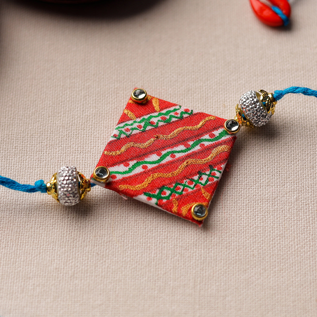 Bishnupur Handpainted Fabric Rakhi 09