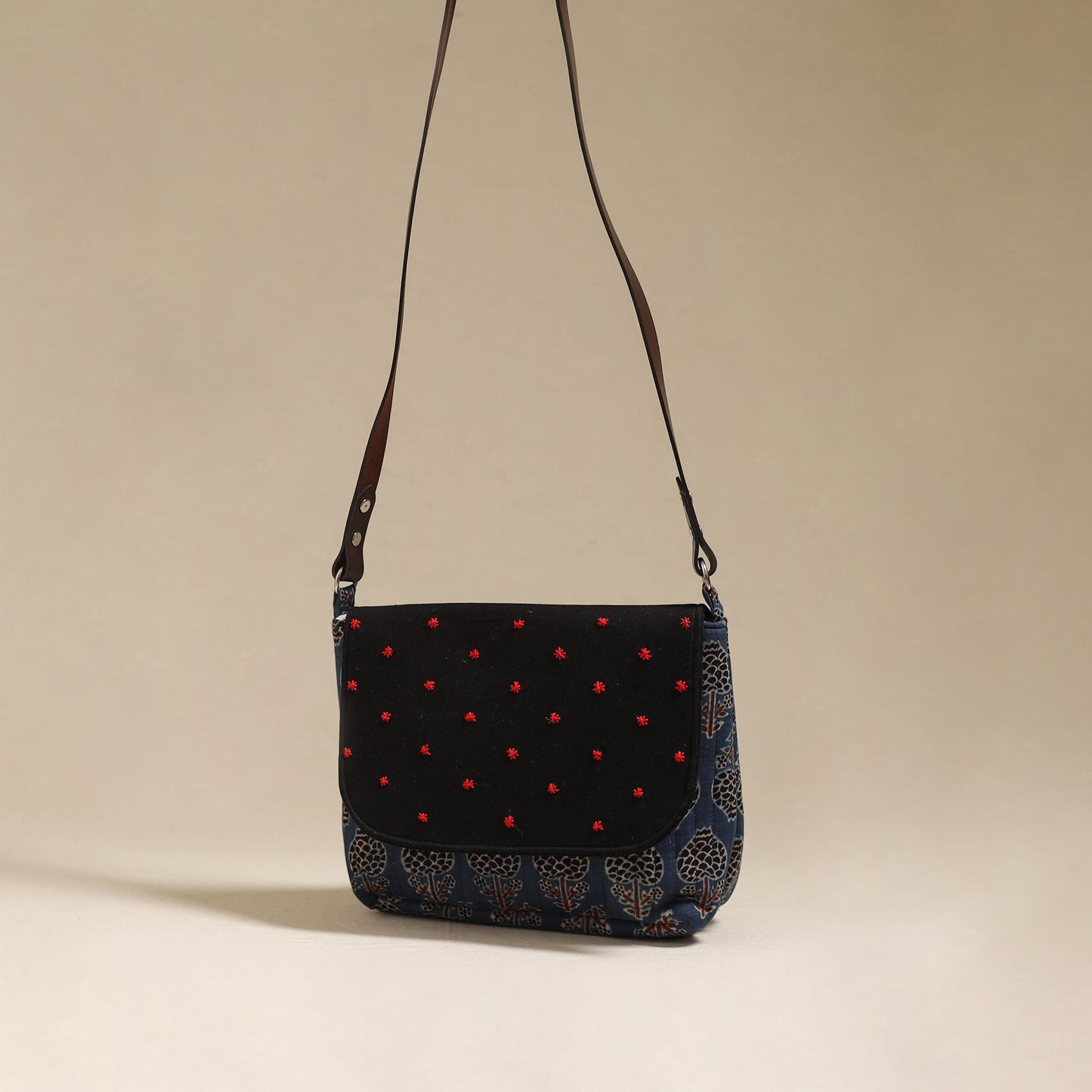 Handcrafted quilted ajrakh block printed fabric sling bag
