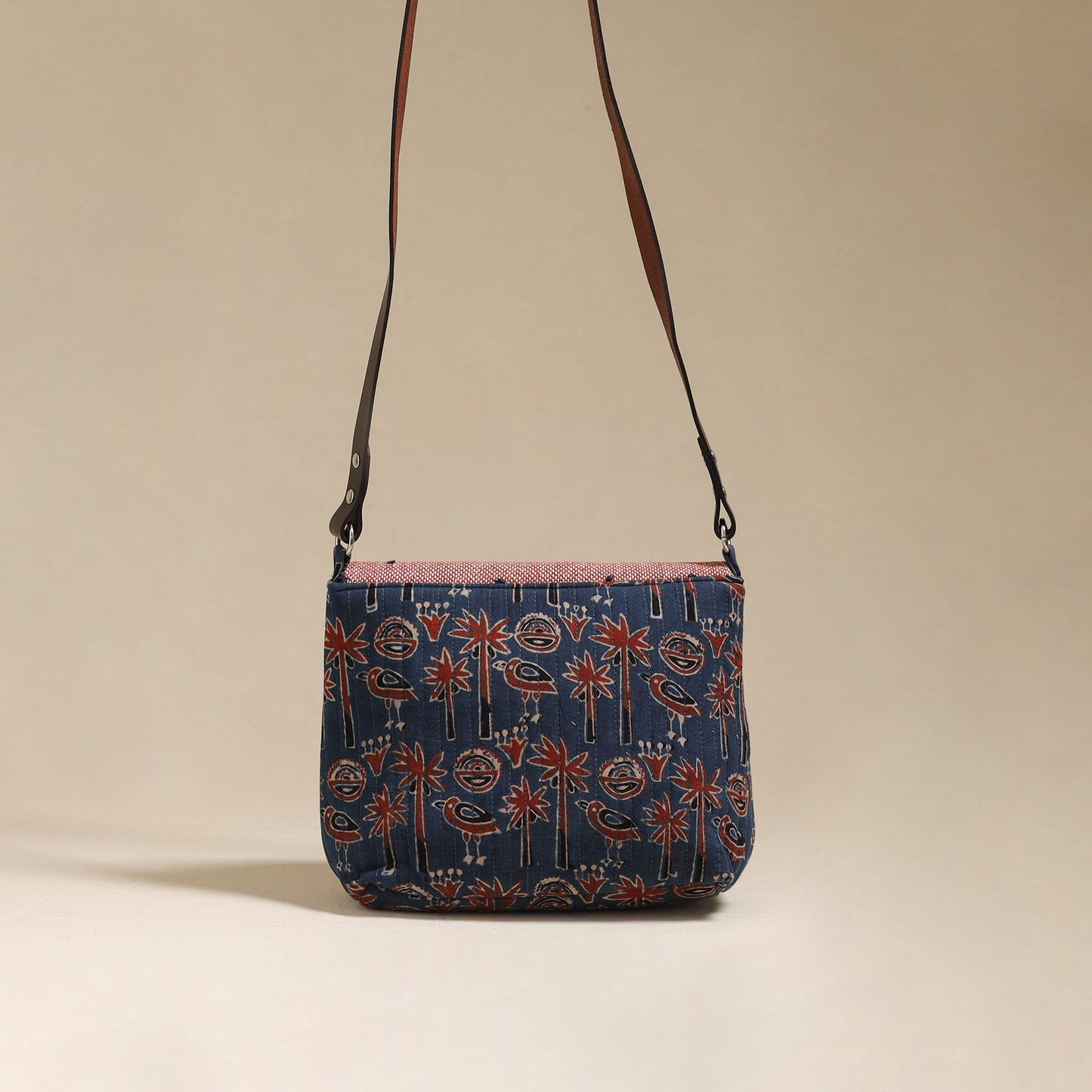 Handcrafted quilted ajrakh block printed fabric sling bag