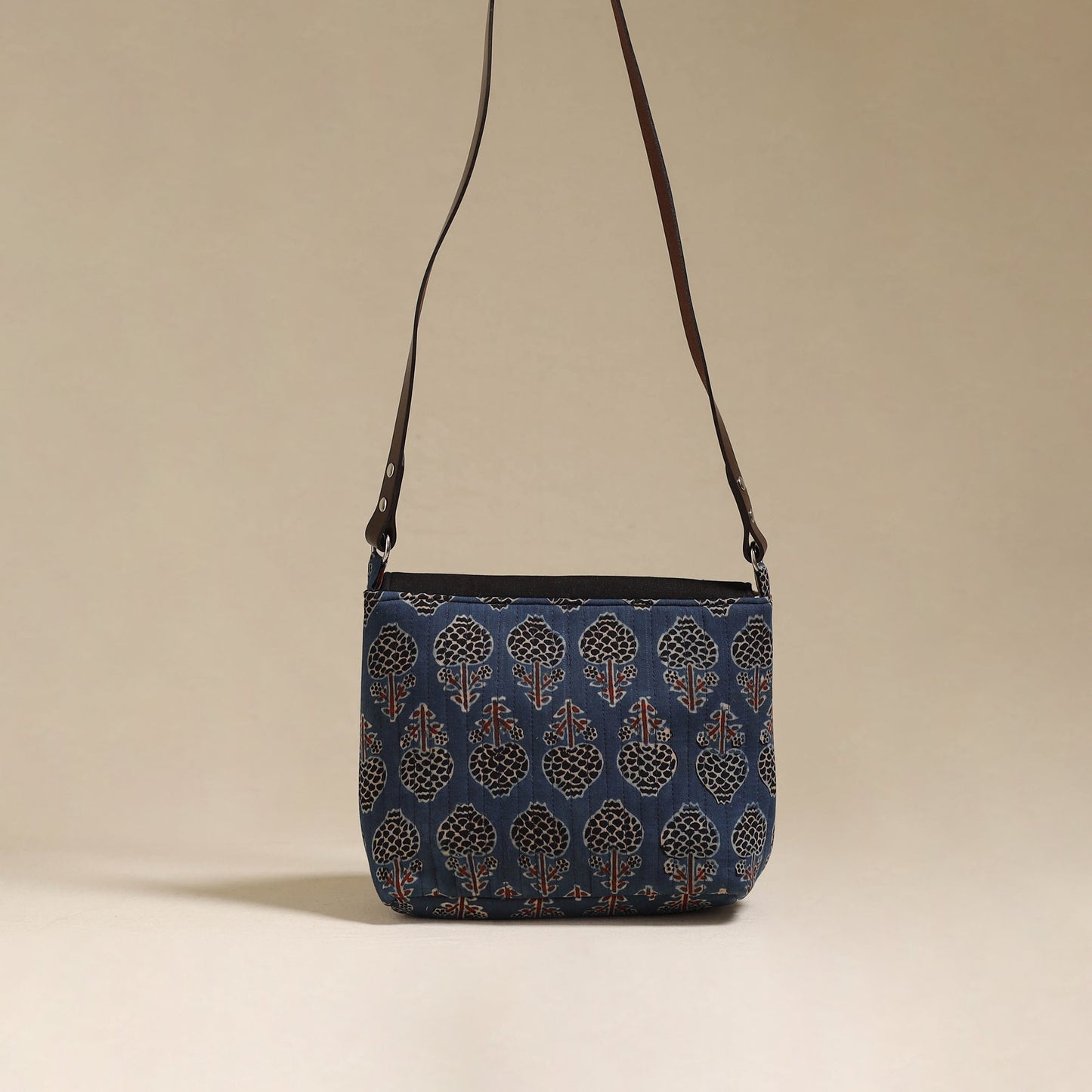 Handcrafted quilted ajrakh block printed fabric sling bag