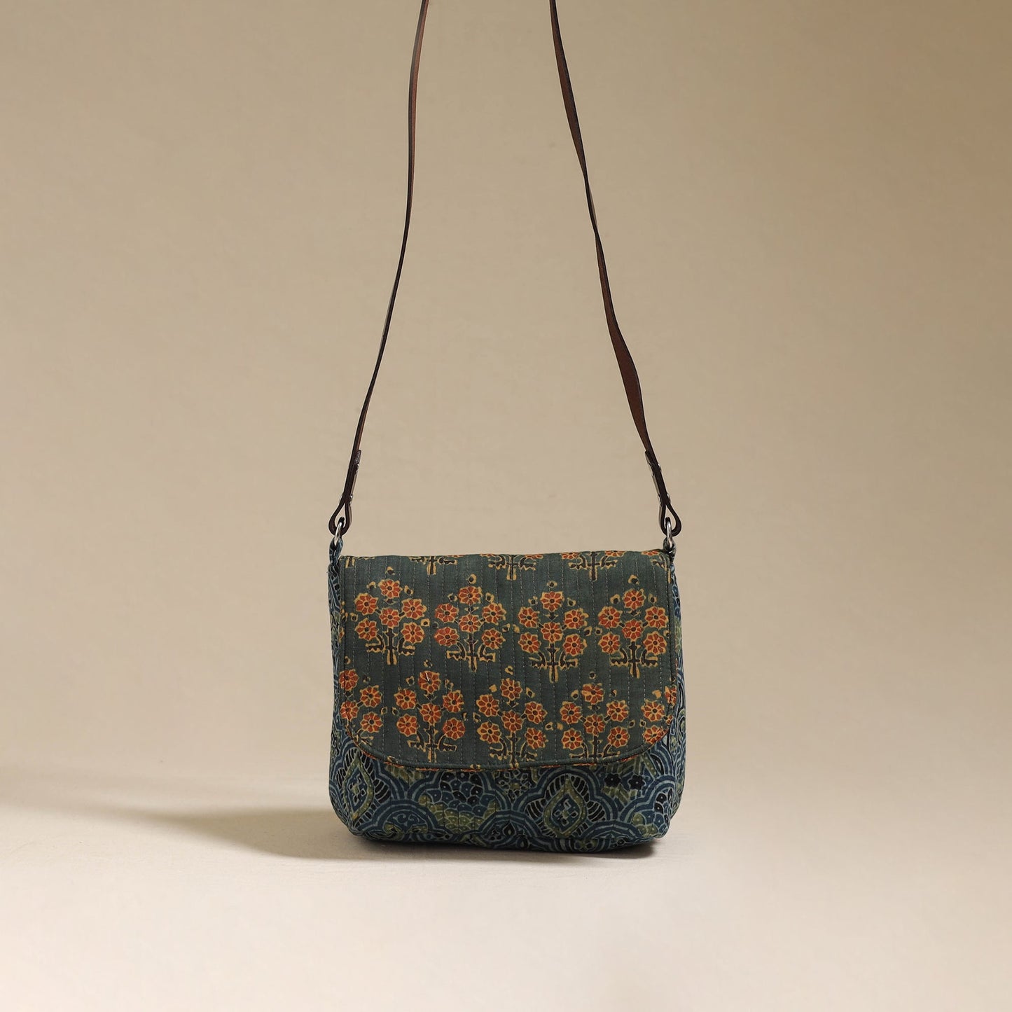 Handcrafted quilted ajrakh block printed fabric sling bag
