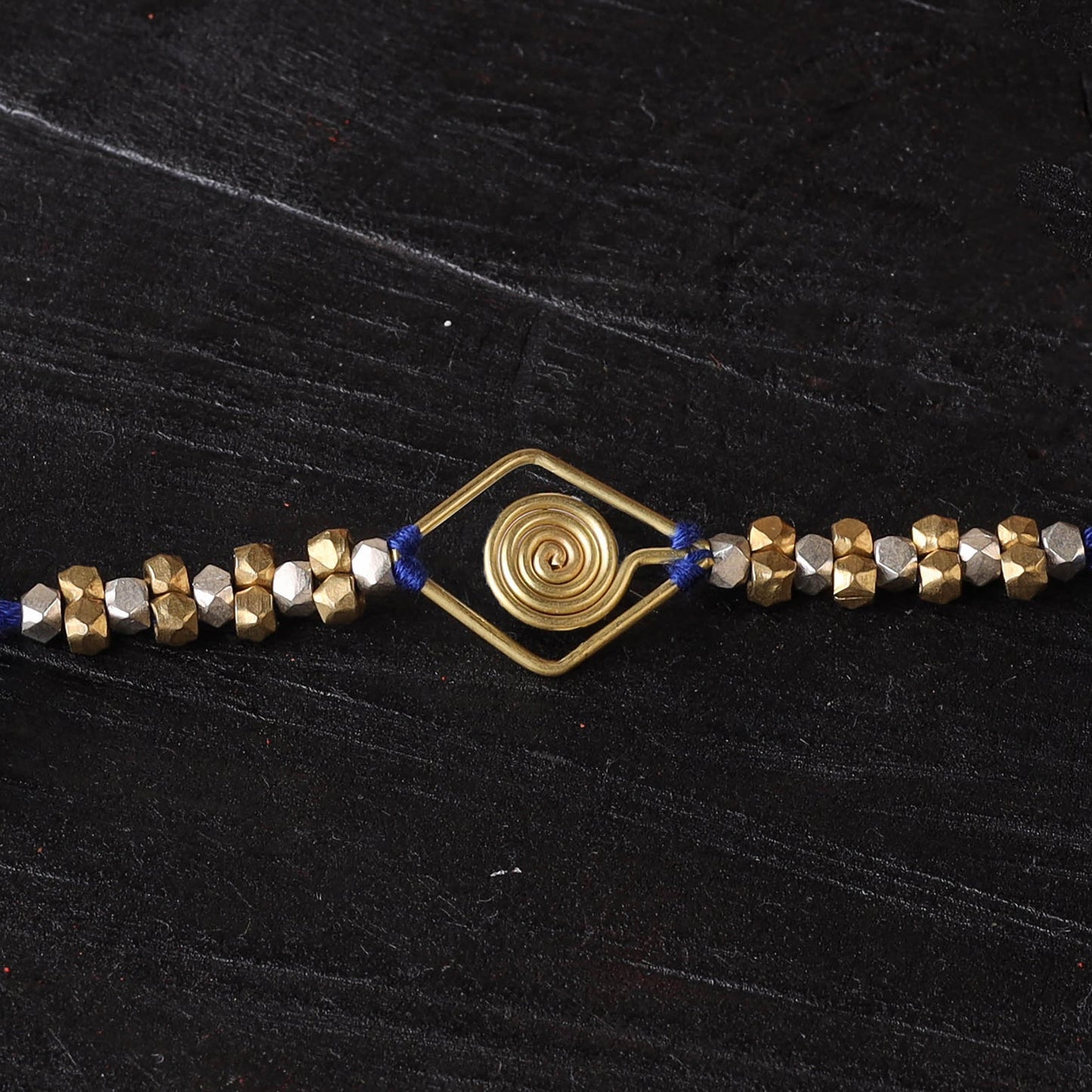 Handcrafted tribal dokra brass thread rakhi 09