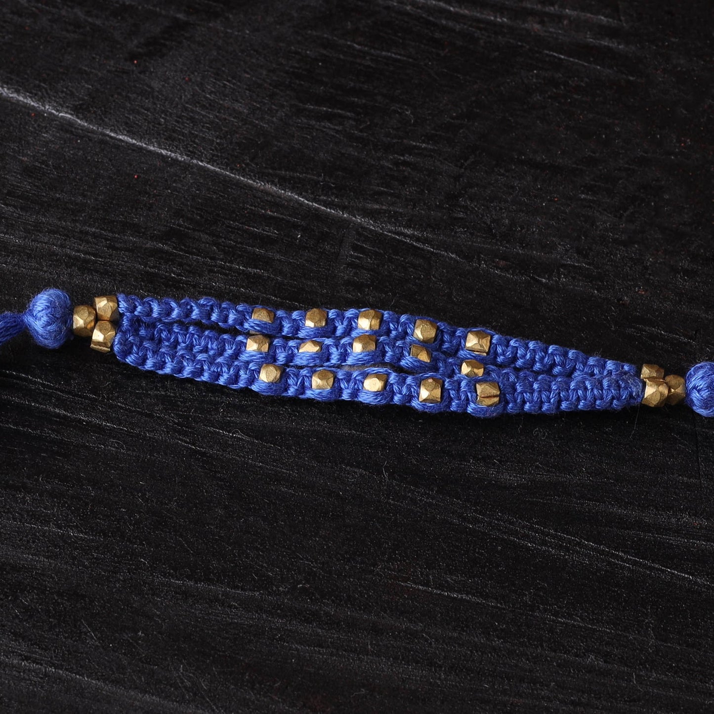 Handcrafted tribal dokra brass thread rakhi 37