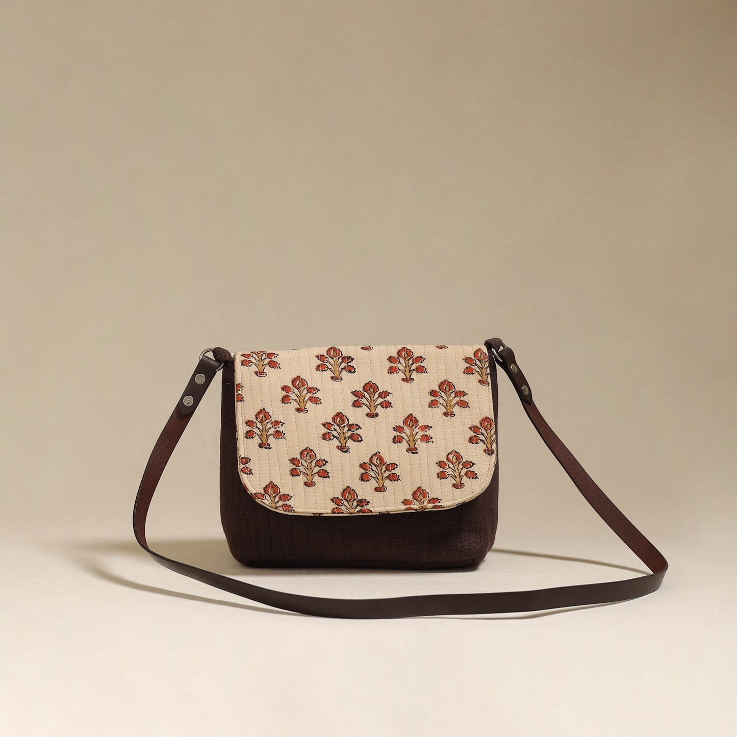 Handcrafted quilted ajrakh block printed fabric sling bag