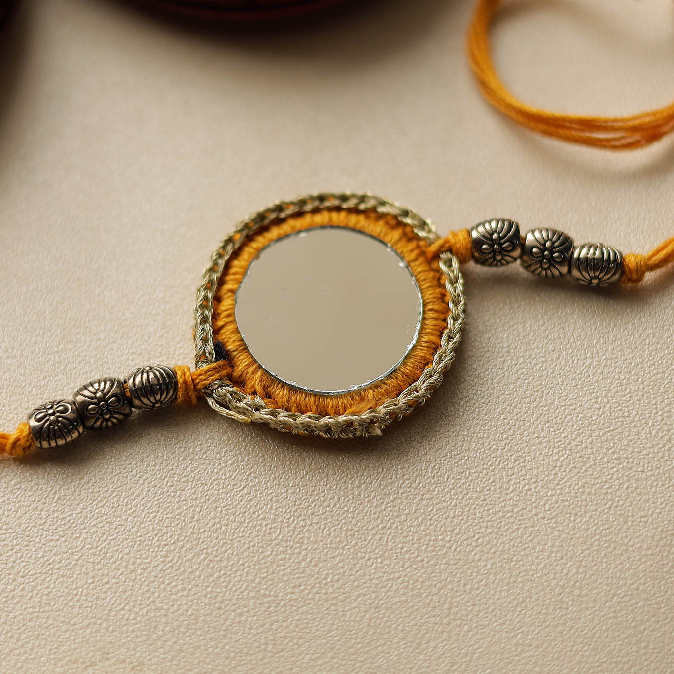 Chakra - Mirror & Crochet Work Rakhi by Abira Creations
