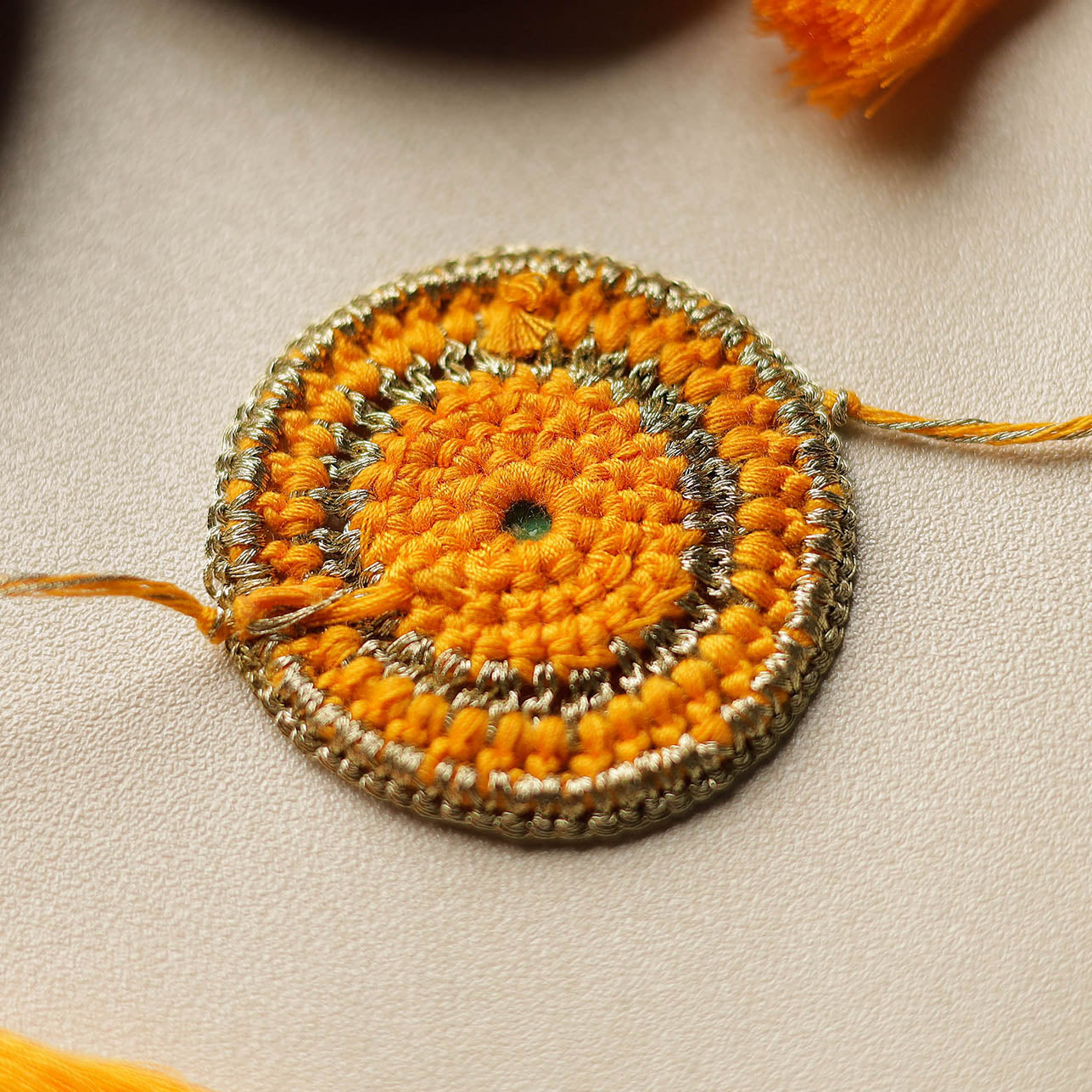 Chakra - Mirror & Crochet Work Rakhi by Abira Creations