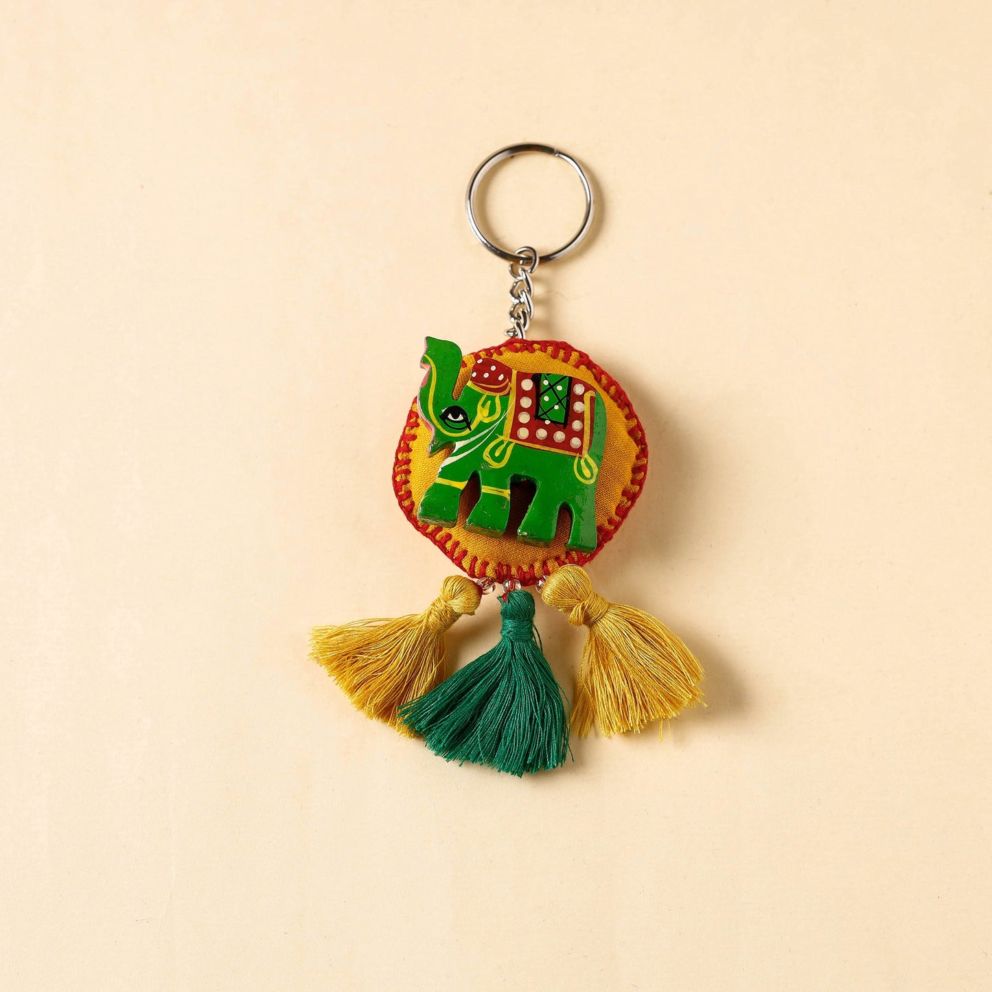 Green Handcrafted Fab Artwork Keychain with Tassels