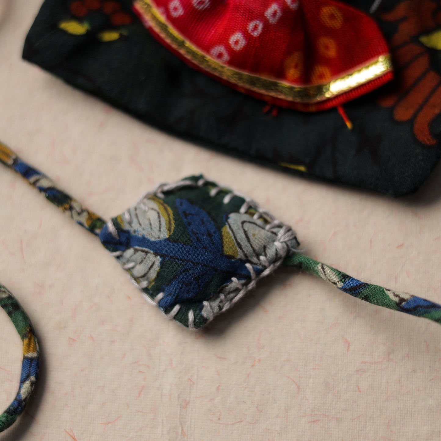 Handcrafted Embroidery Fabart Rakhi 04