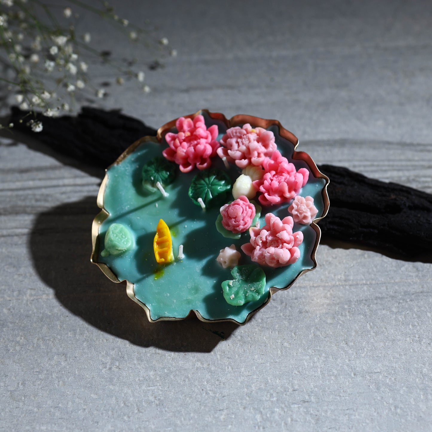 Handcrafted metal urli water lily pond soy wax scented