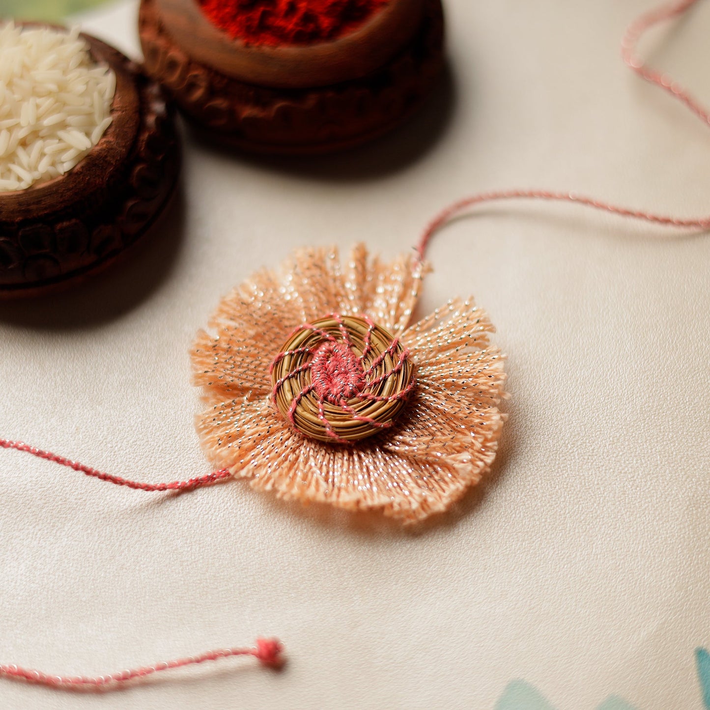 Handcrafted Pine Needles Hibiscus Rakhi by Pirul