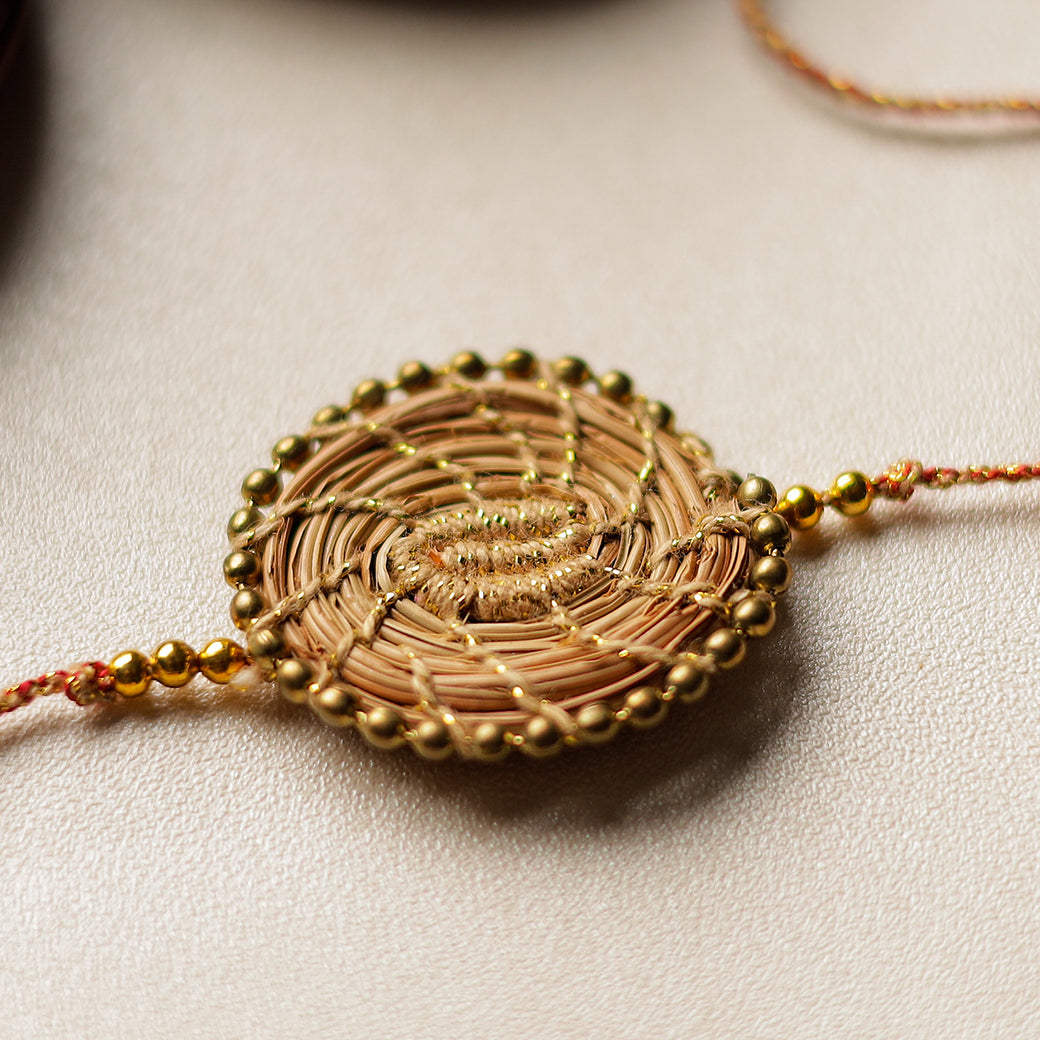 Handcrafted Pine Needles Hibiscus Rakhi by Pirul
