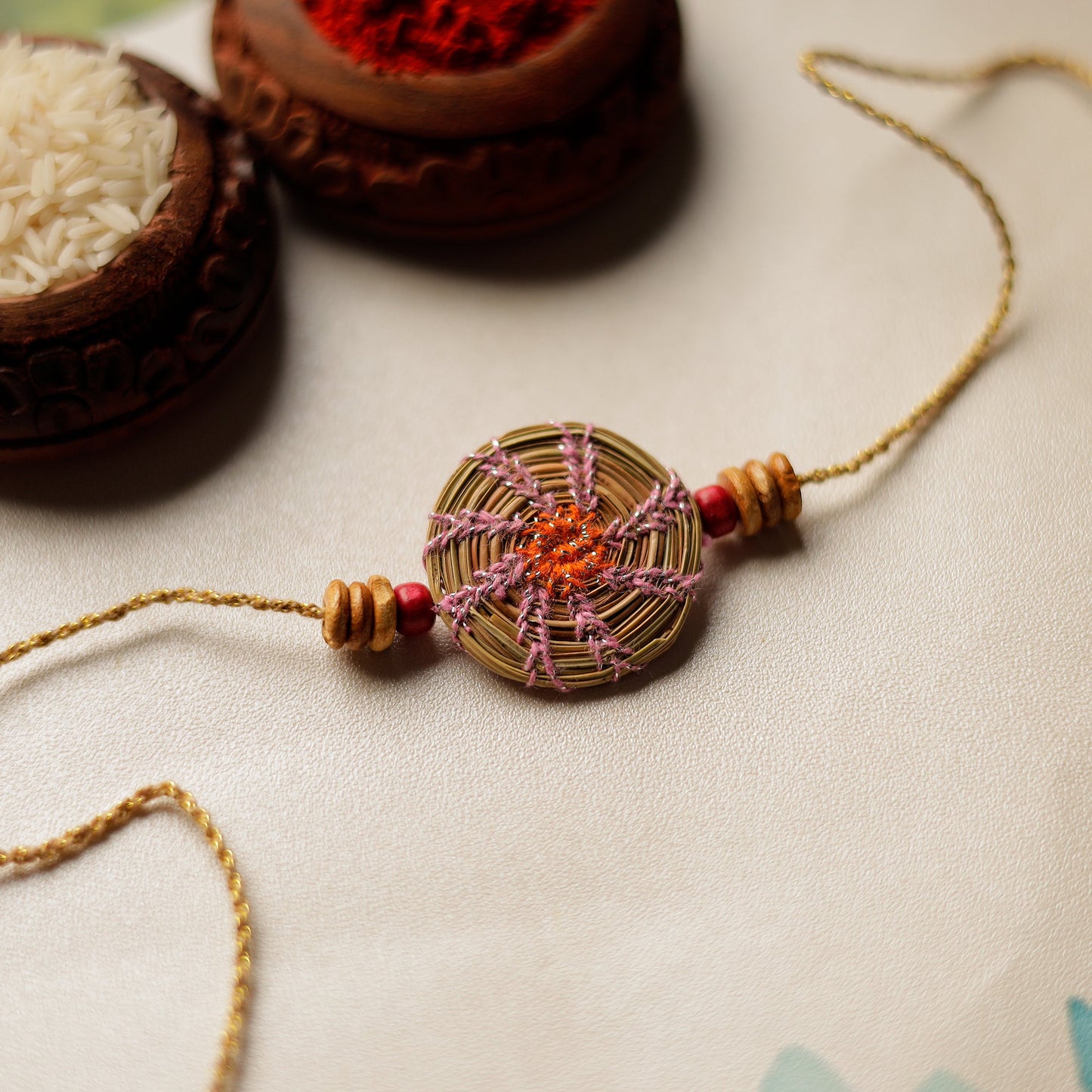 Handcrafted Pine Needles Hibiscus Rakhi by Pirul