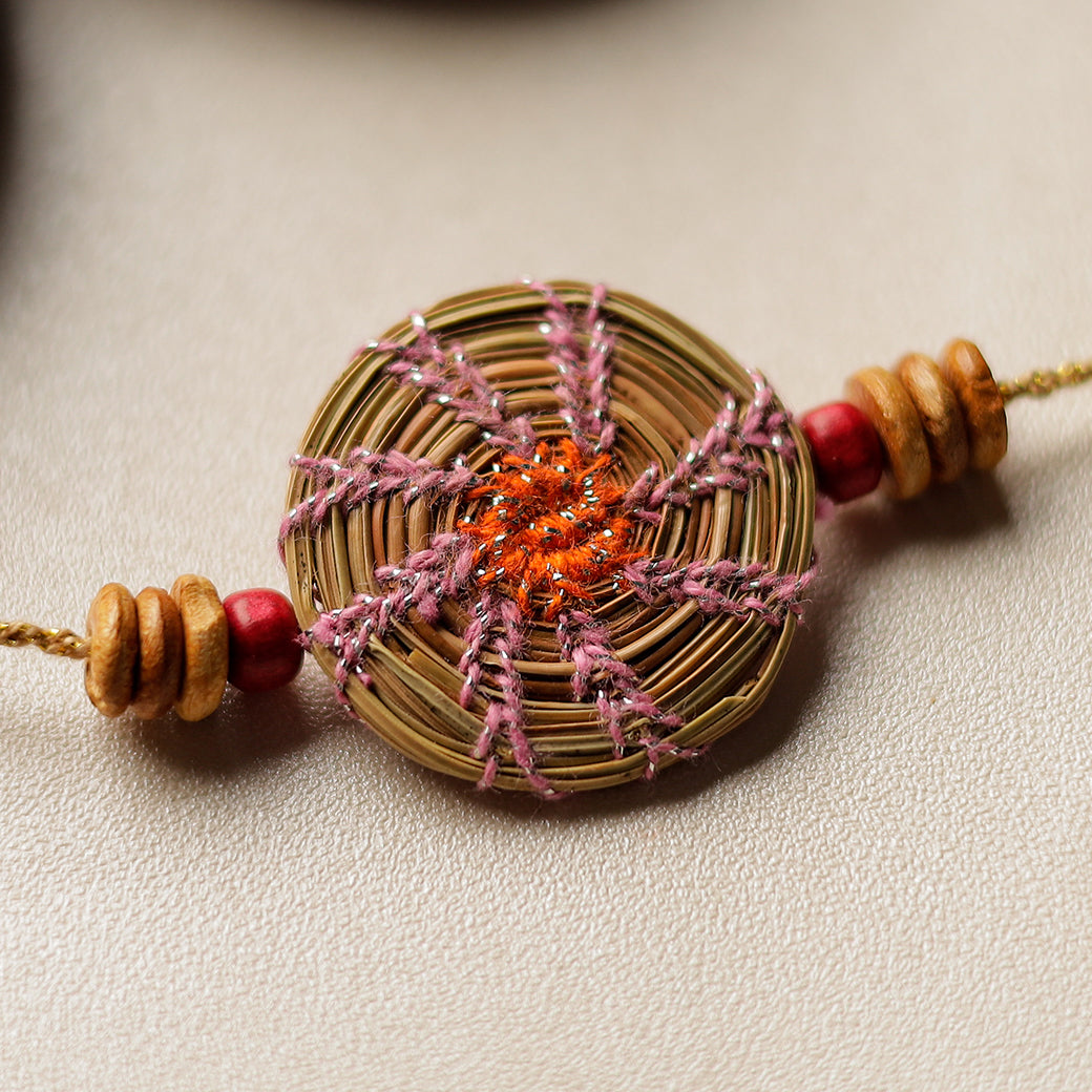 Handcrafted Pine Needles Hibiscus Rakhi by Pirul