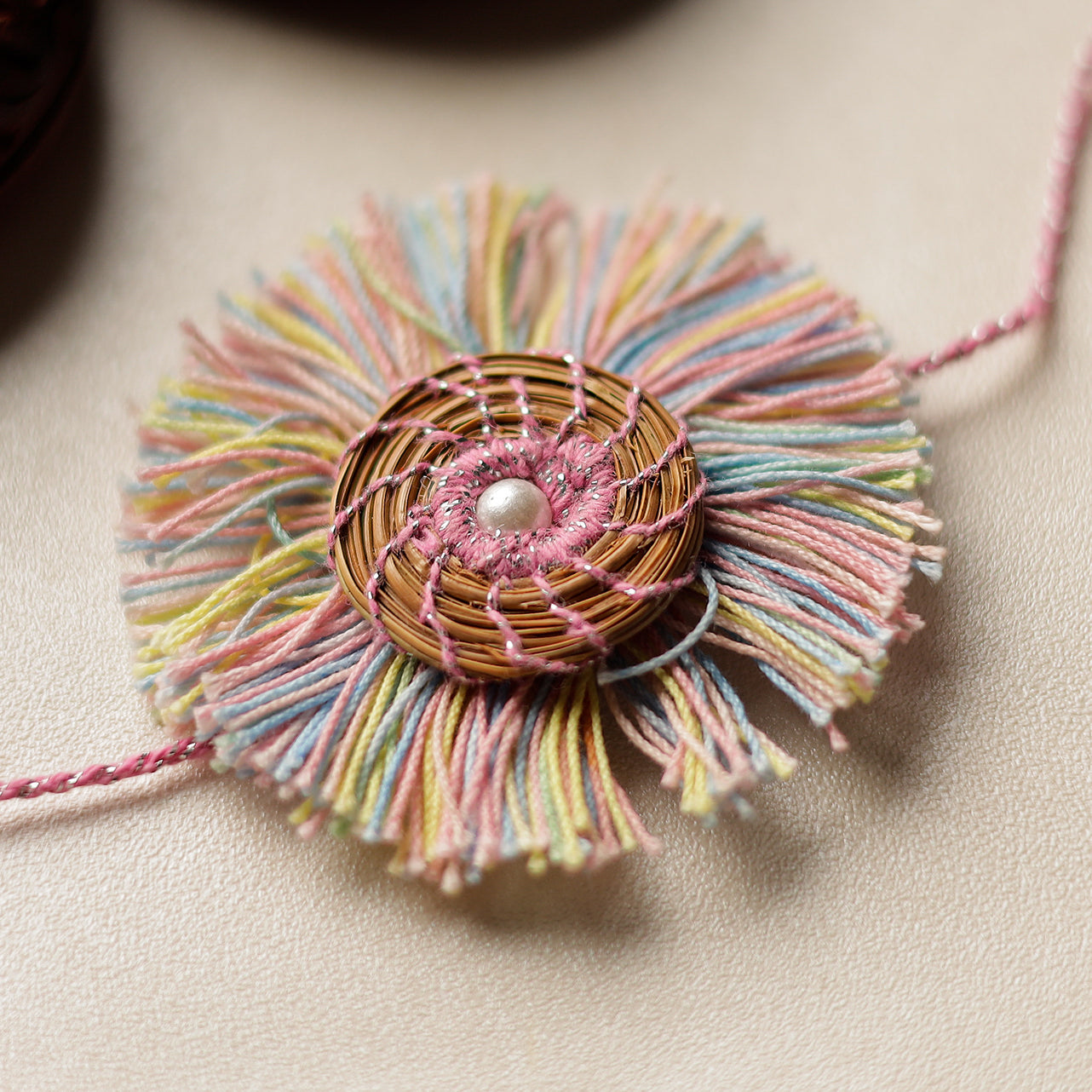 Handcrafted Pine Needles Hibiscus Rakhi by Pirul