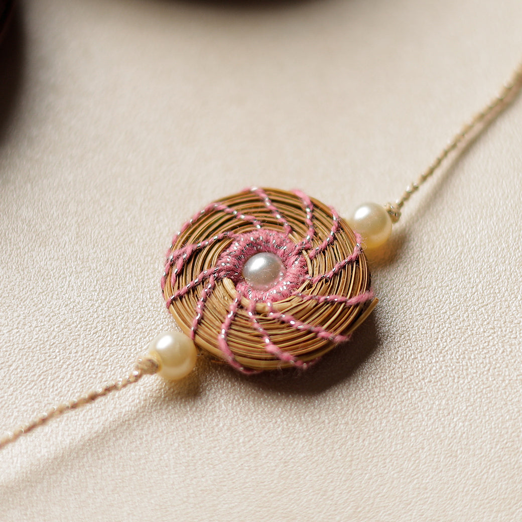 Handcrafted Pine Needles Hibiscus Rakhi by Pirul