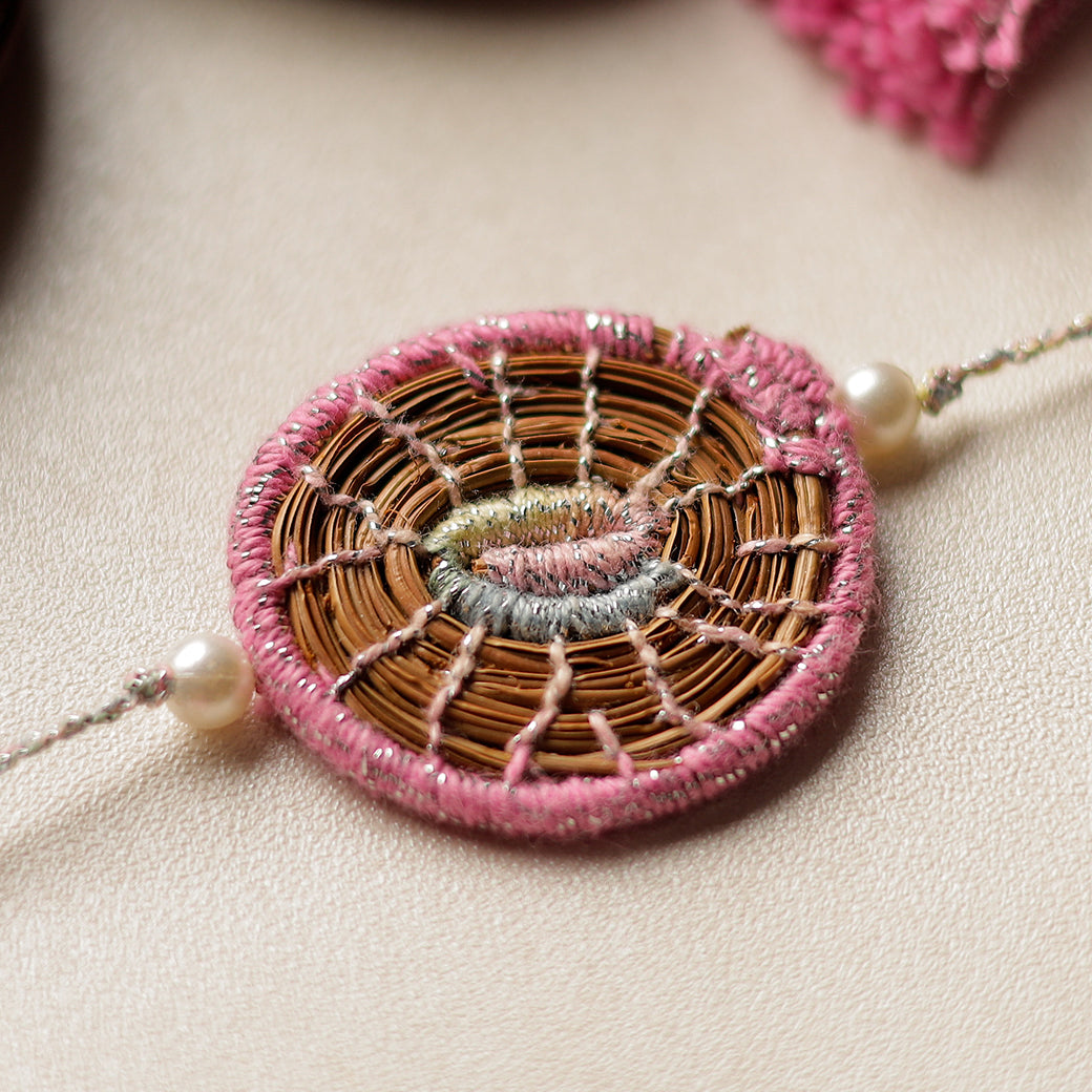 Handcrafted Pine Needles Hibiscus Rakhi by Pirul