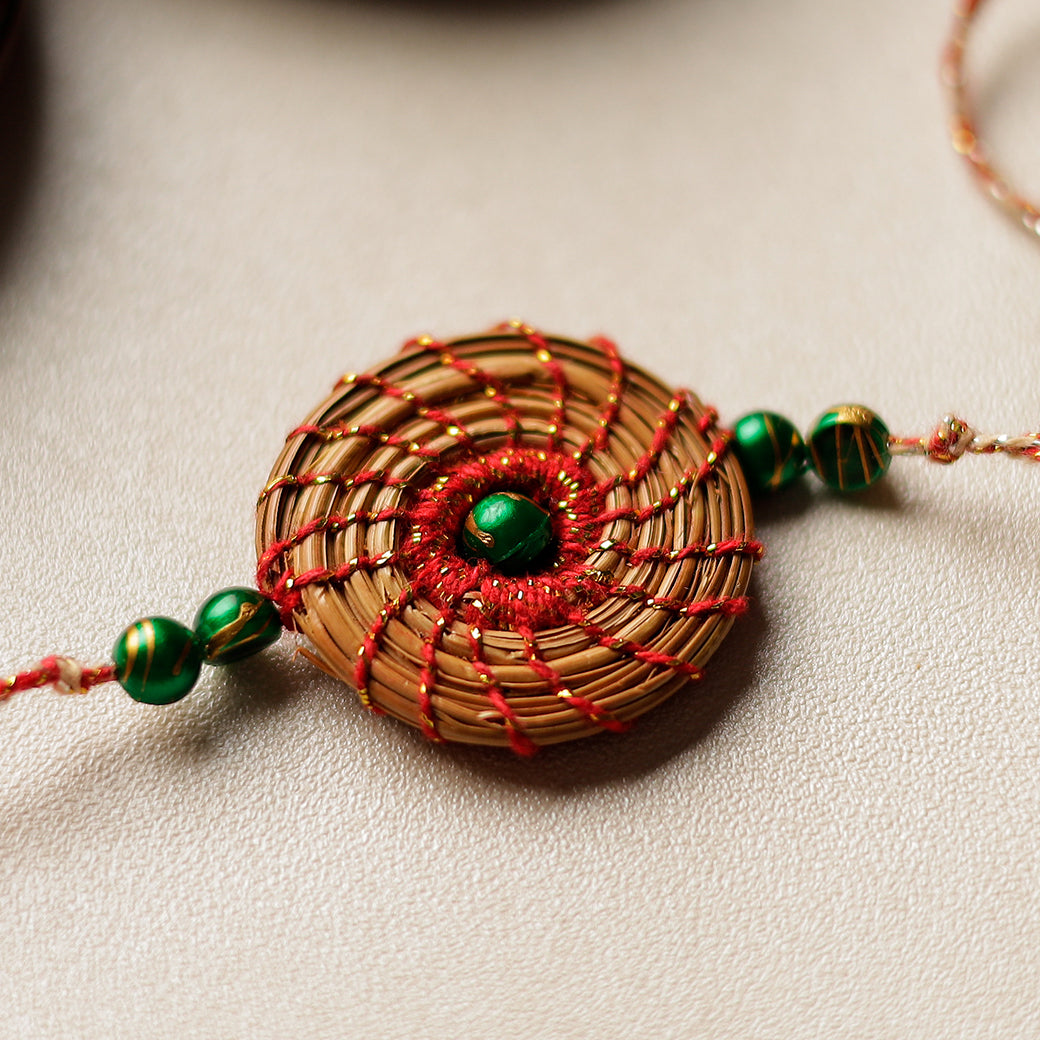 Handcrafted Pine Needles Hibiscus Rakhi by Pirul