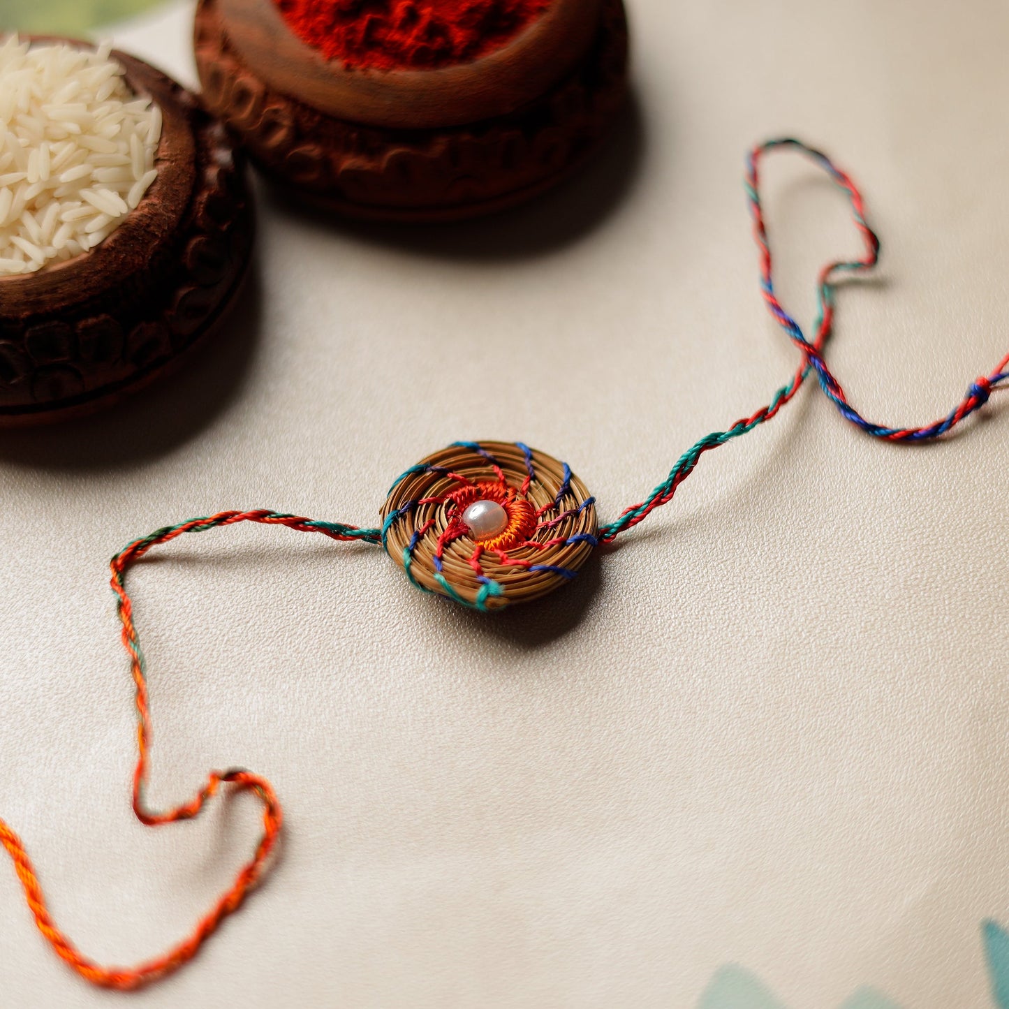 Handcrafted Pine Needles Hibiscus Rakhi by Pirul