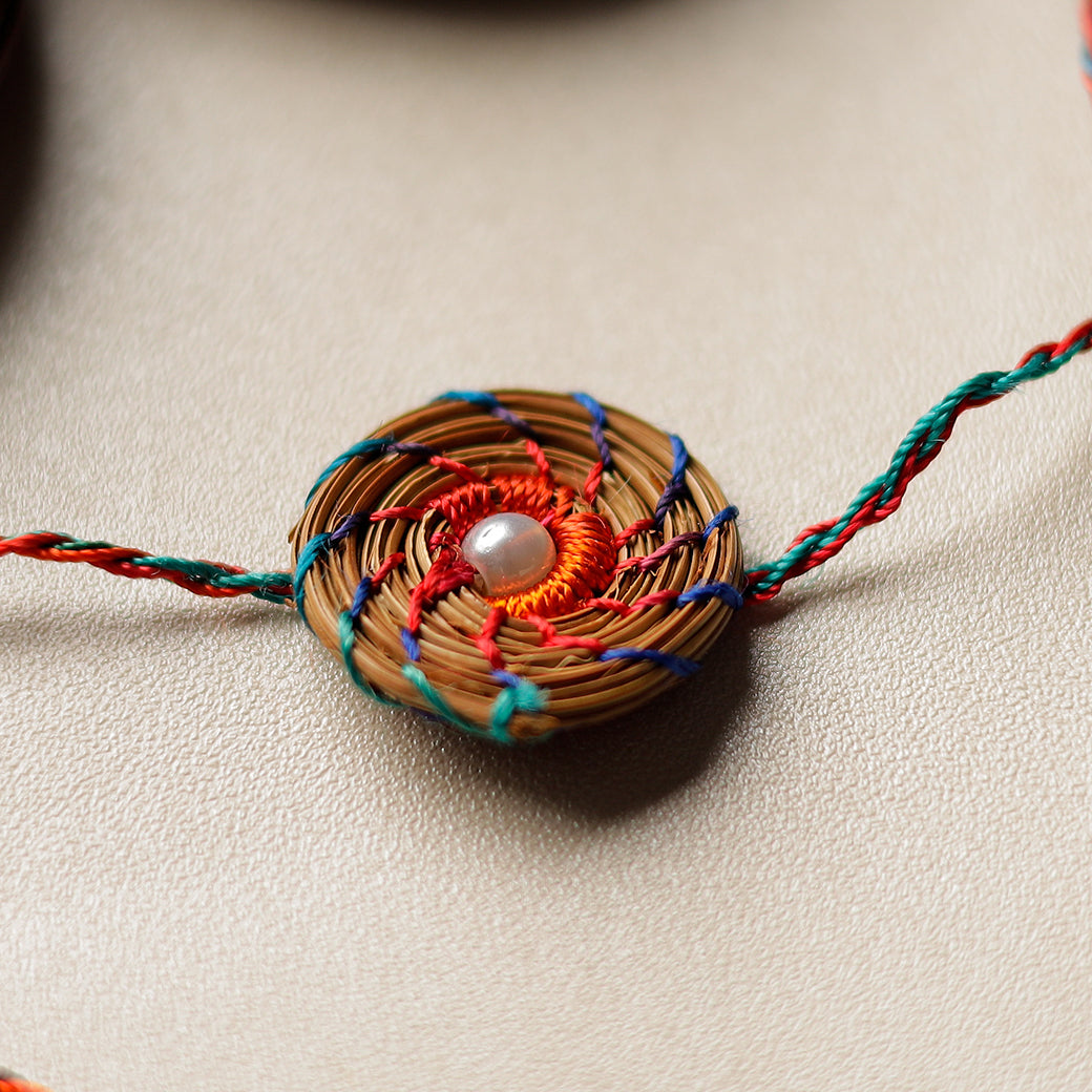 Handcrafted Pine Needles Hibiscus Rakhi by Pirul