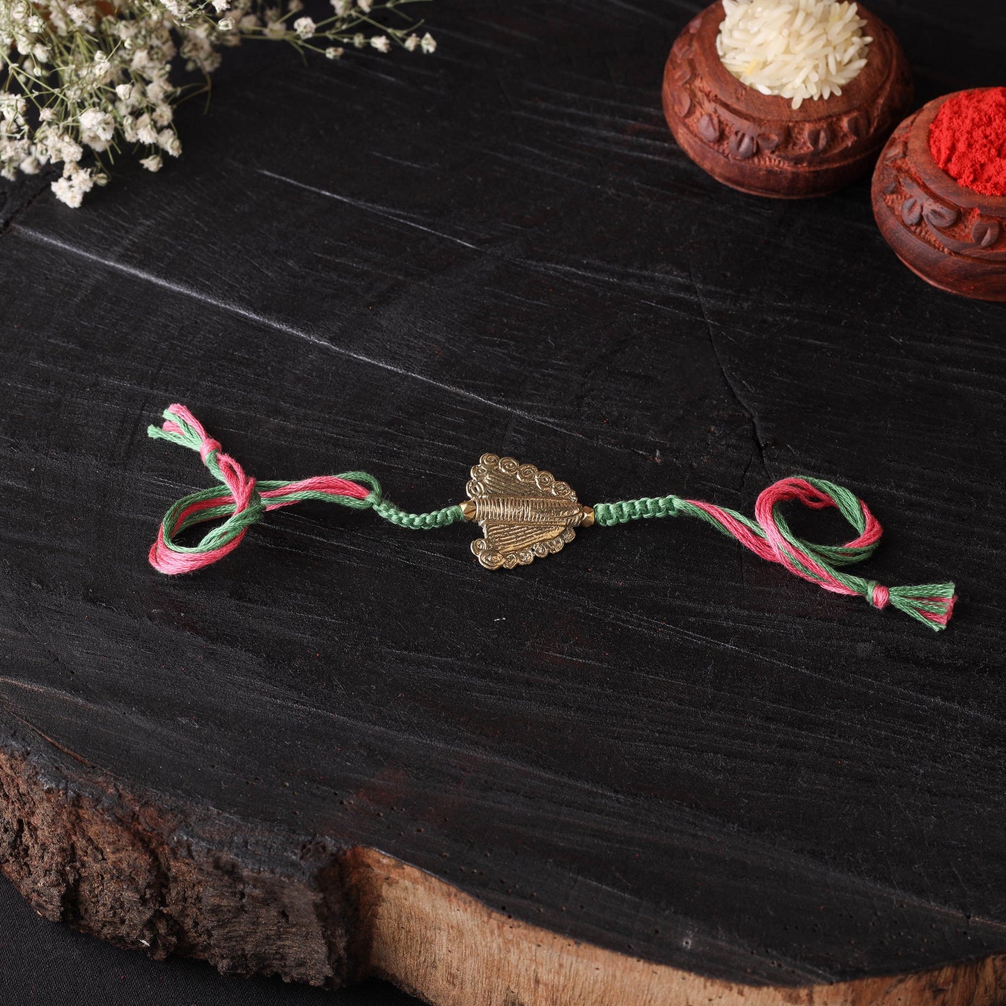 Handcrafted tribal dokra brass thread rakhi 01