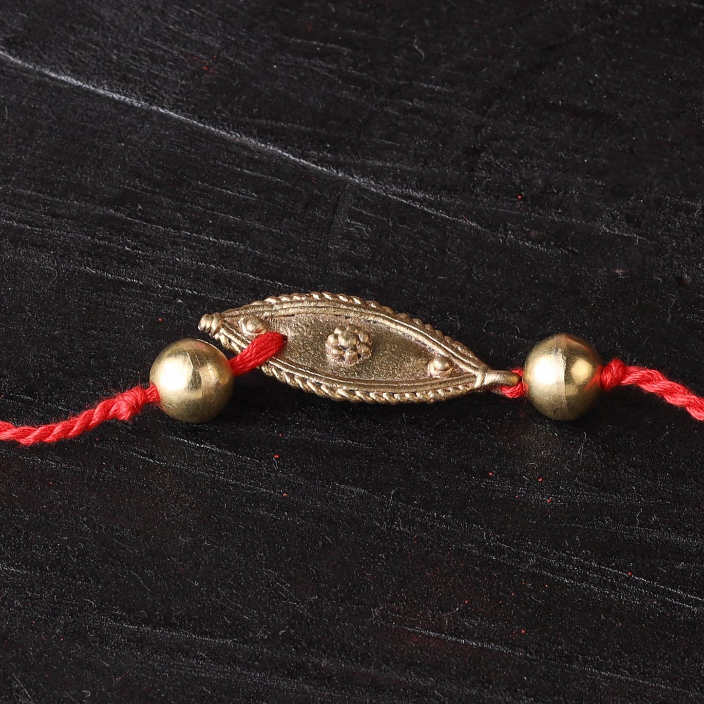 Handcrafted tribal dokra brass thread rakhi 02