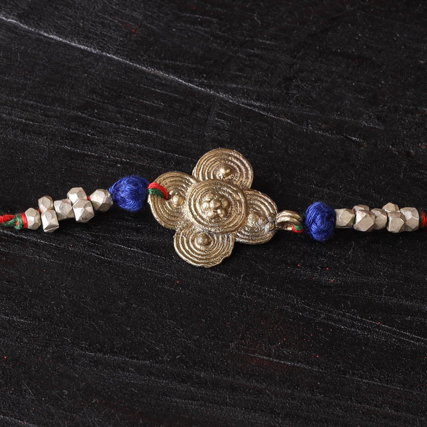 Handcrafted tribal dokra brass thread rakhi 04