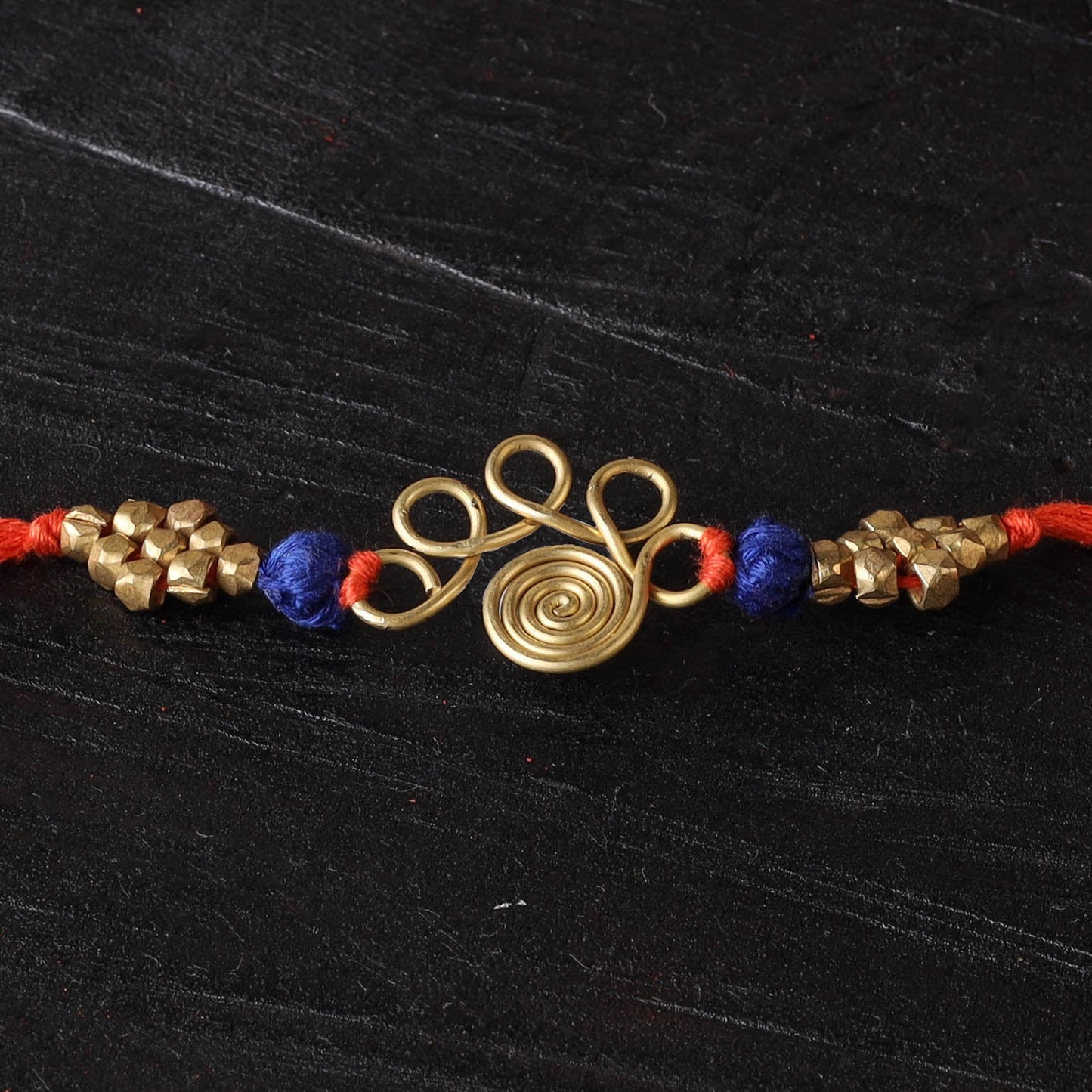 Handcrafted tribal dokra brass thread rakhi 05