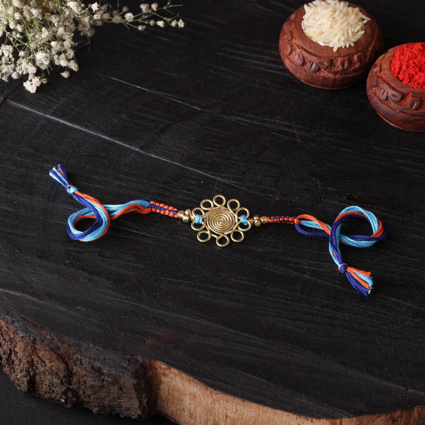 Handcrafted tribal dokra brass thread rakhi 06