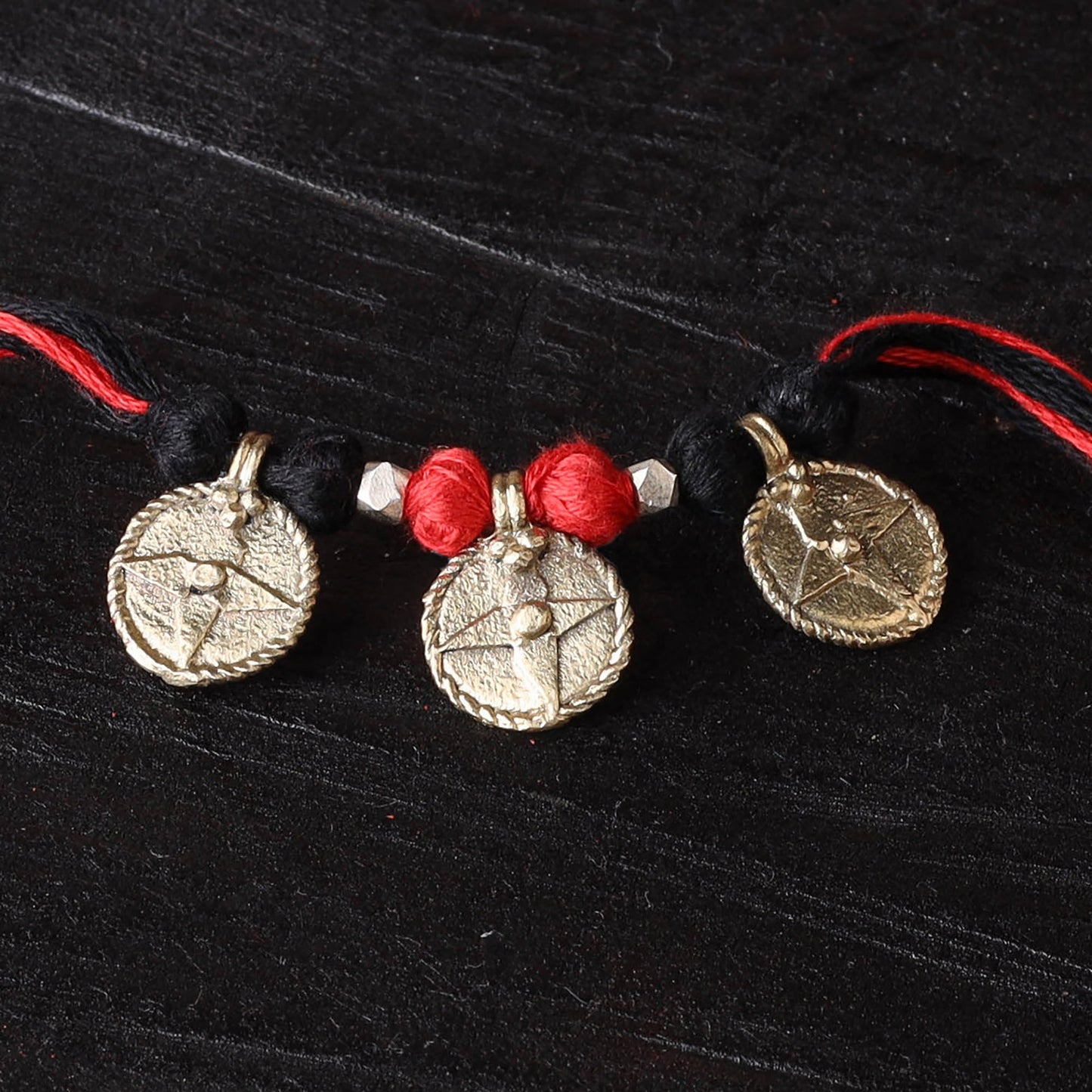 Handcrafted tribal dokra brass thread rakhi 07