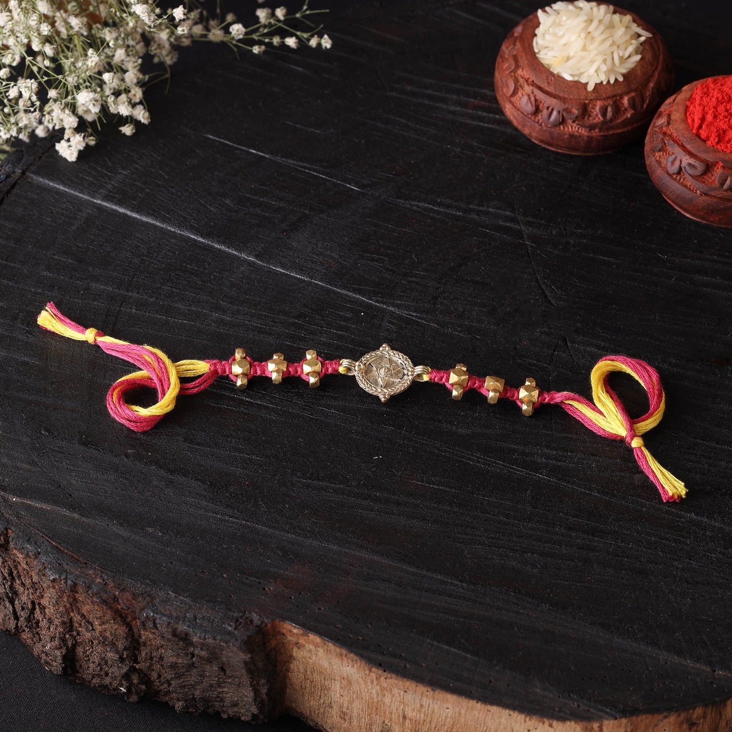 Handcrafted tribal dokra brass thread rakhi 08