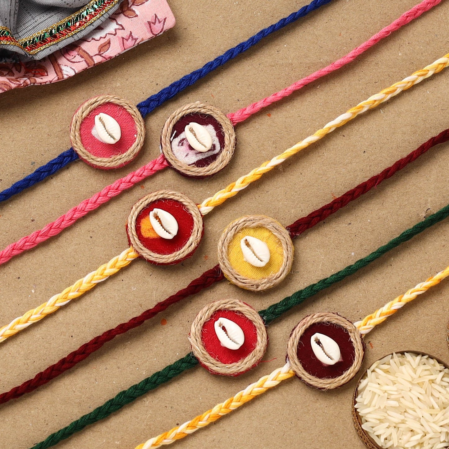 Handmade jute fabart shell work rakhi (set of 6) 152