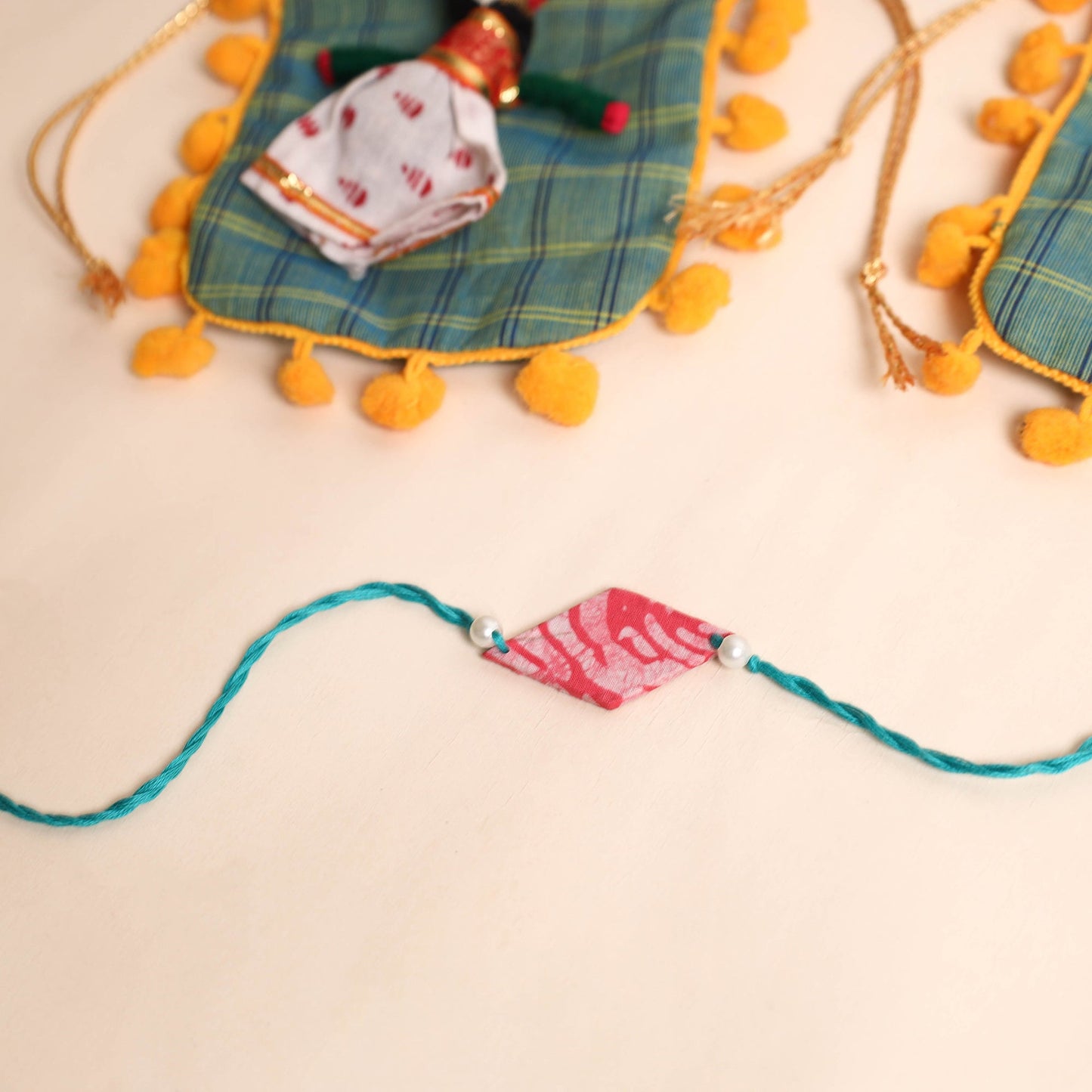 Handmade Pearl Fabric Rakhi (Set of 2)