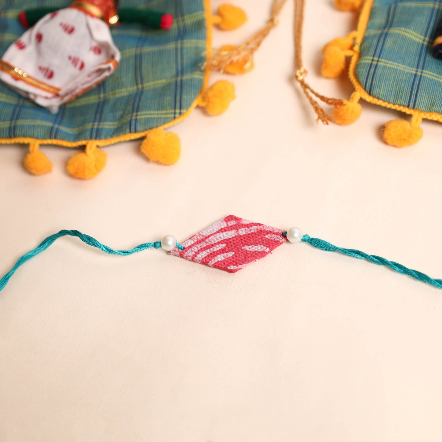 Handmade Pearl Fabric Rakhi (Set of 2)