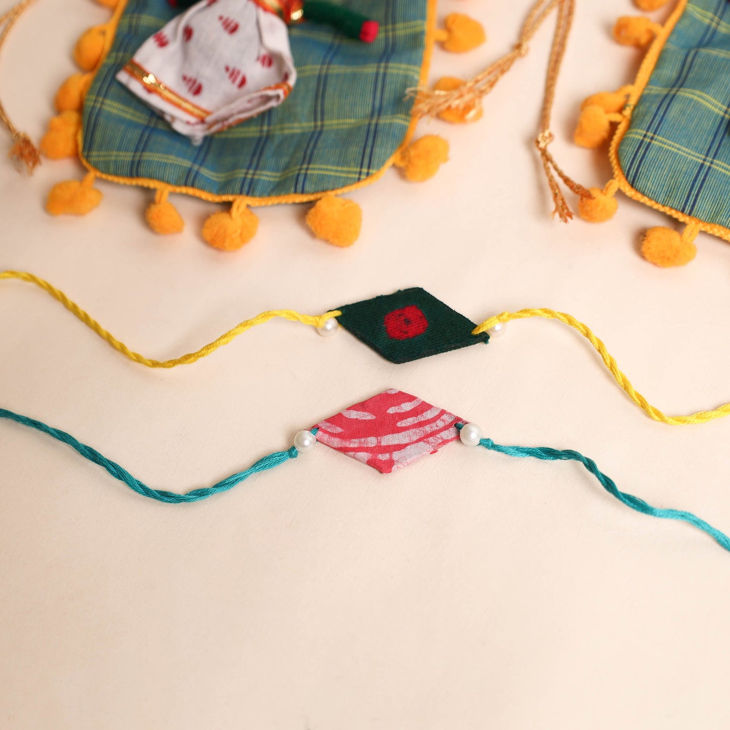 Handmade Pearl Fabric Rakhi (Set of 2)