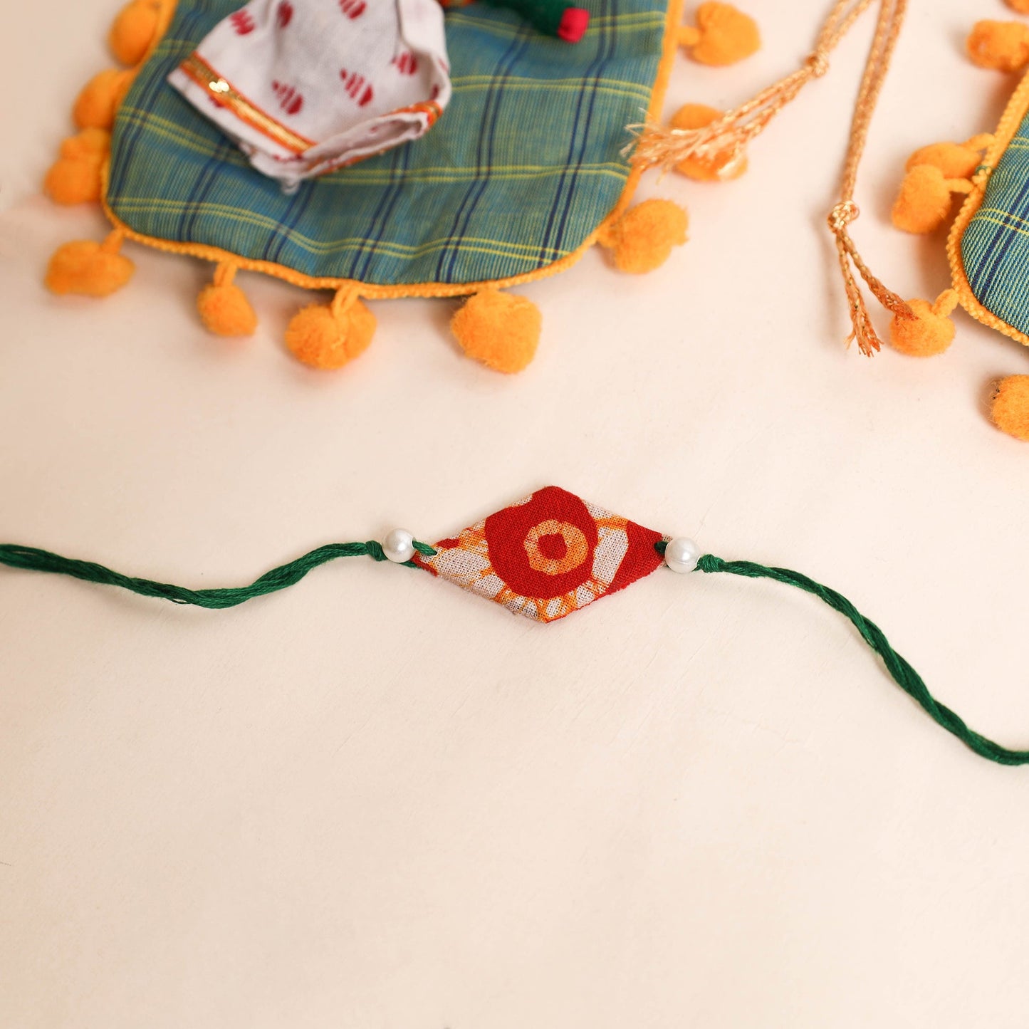 Handmade Pearl Fabric Rakhi (Set of 2)