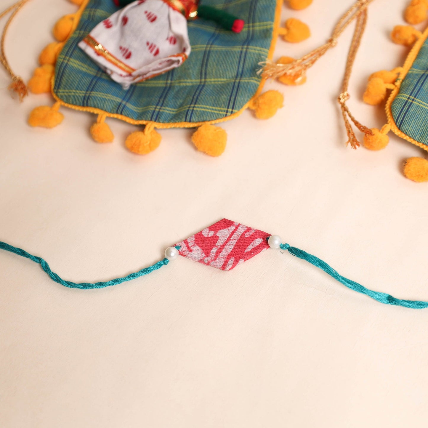 Handmade Pearl Fabric Rakhi (Set of 2)